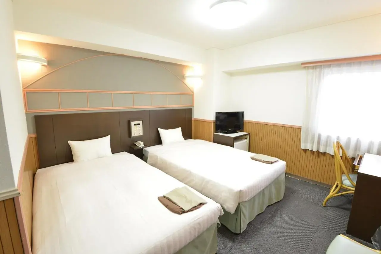 Bed in Hotel Marutani