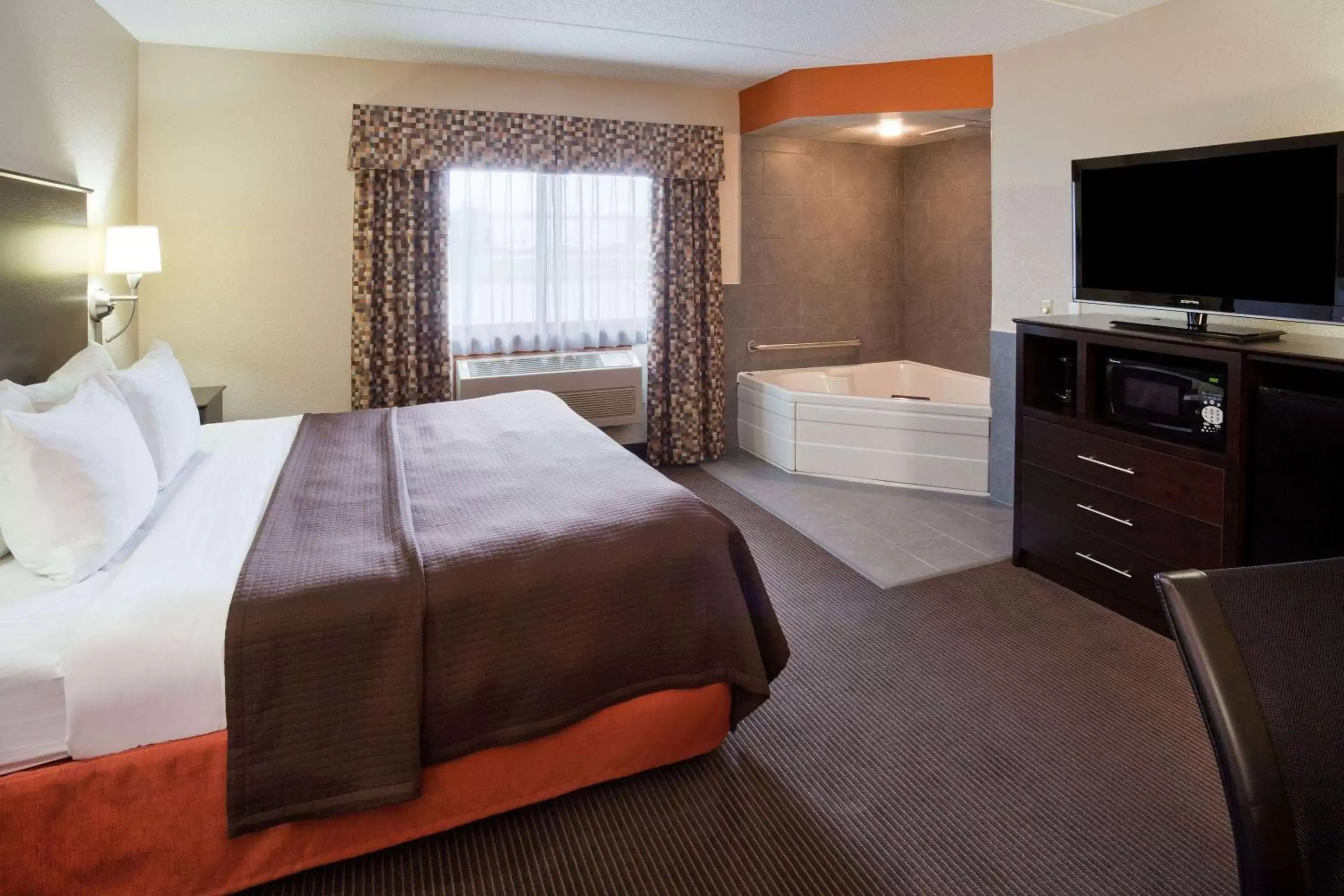 Photo of the whole room, Bed in AmericInn by Wyndham Plover Stevens Point