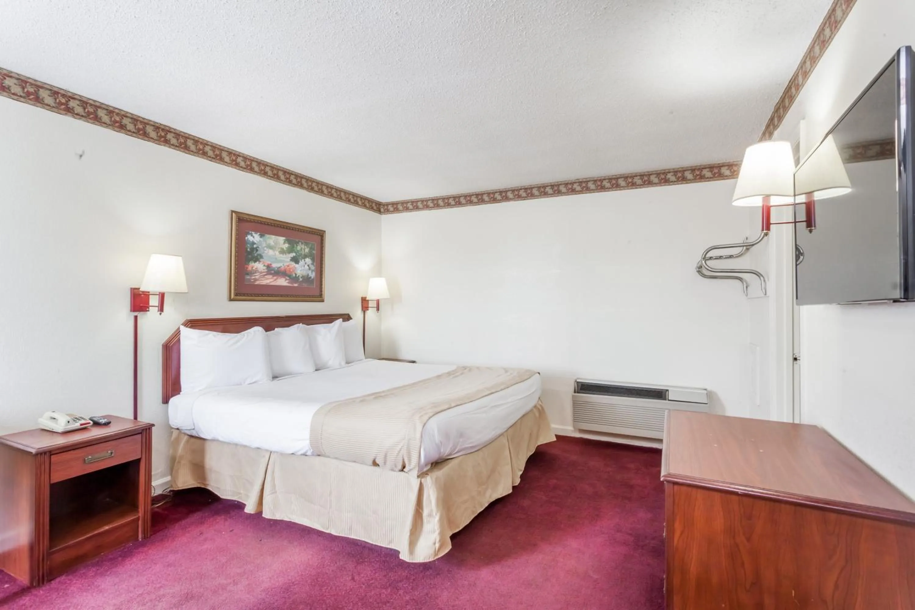 Bed in Knights Inn Hurricane Mills