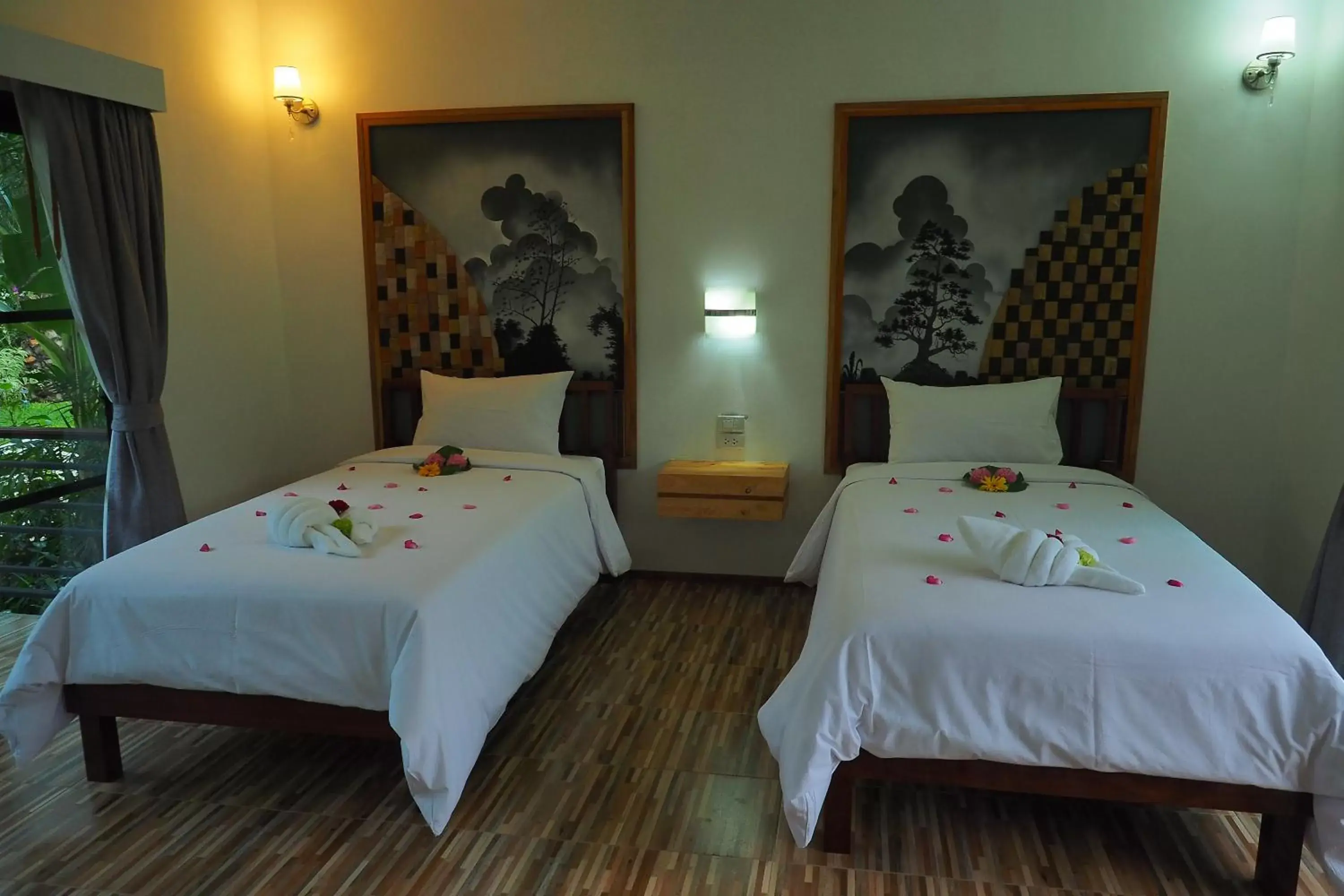 Bed in Palm Pran Resort