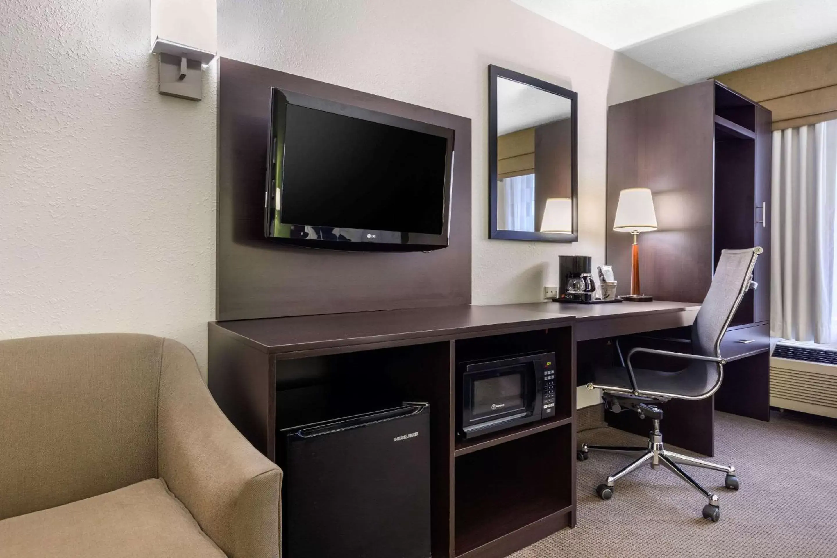 Photo of the whole room, TV/Entertainment Center in Sleep Inn near I-80 and I-94