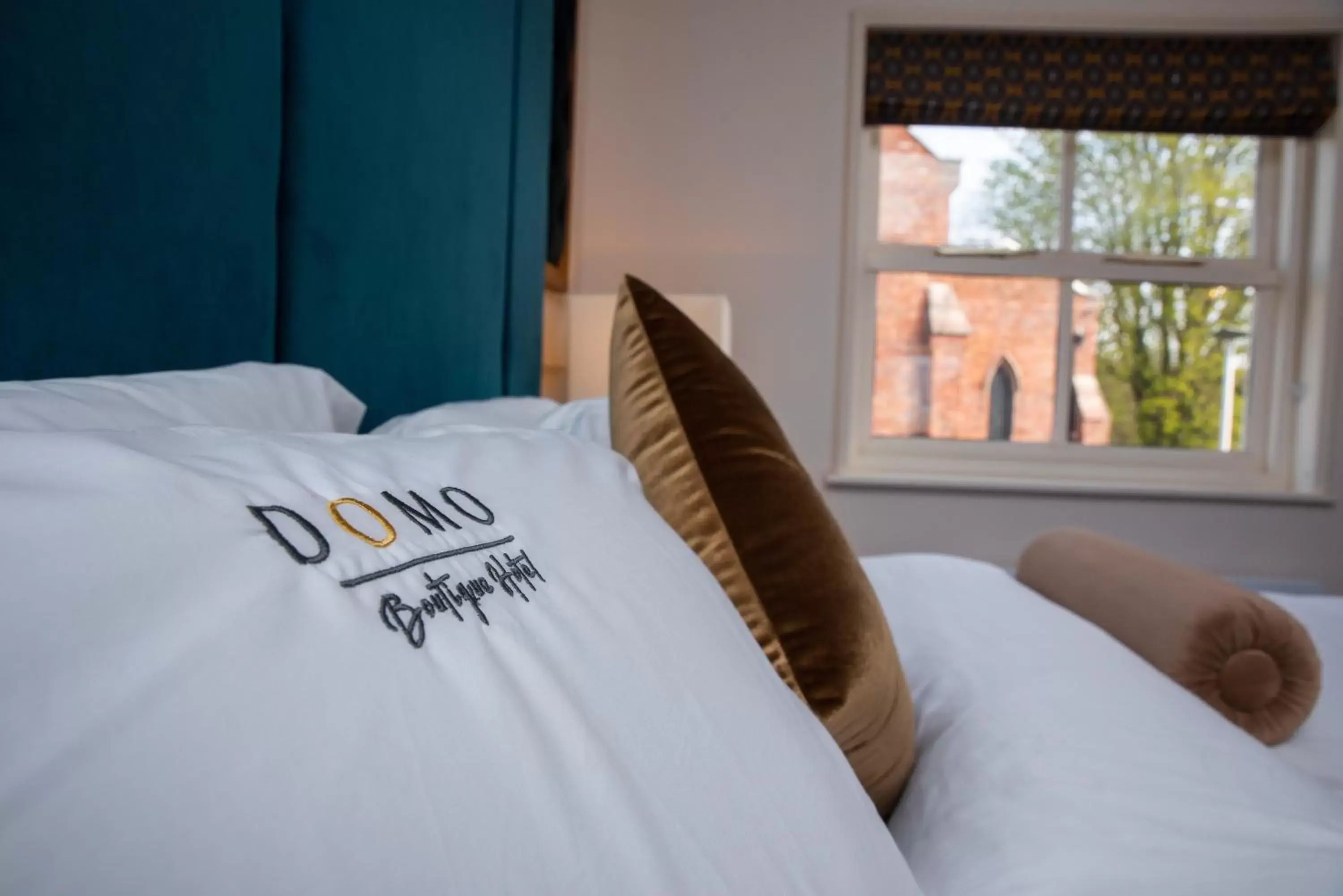 Bed in Domo Boutique Hotel