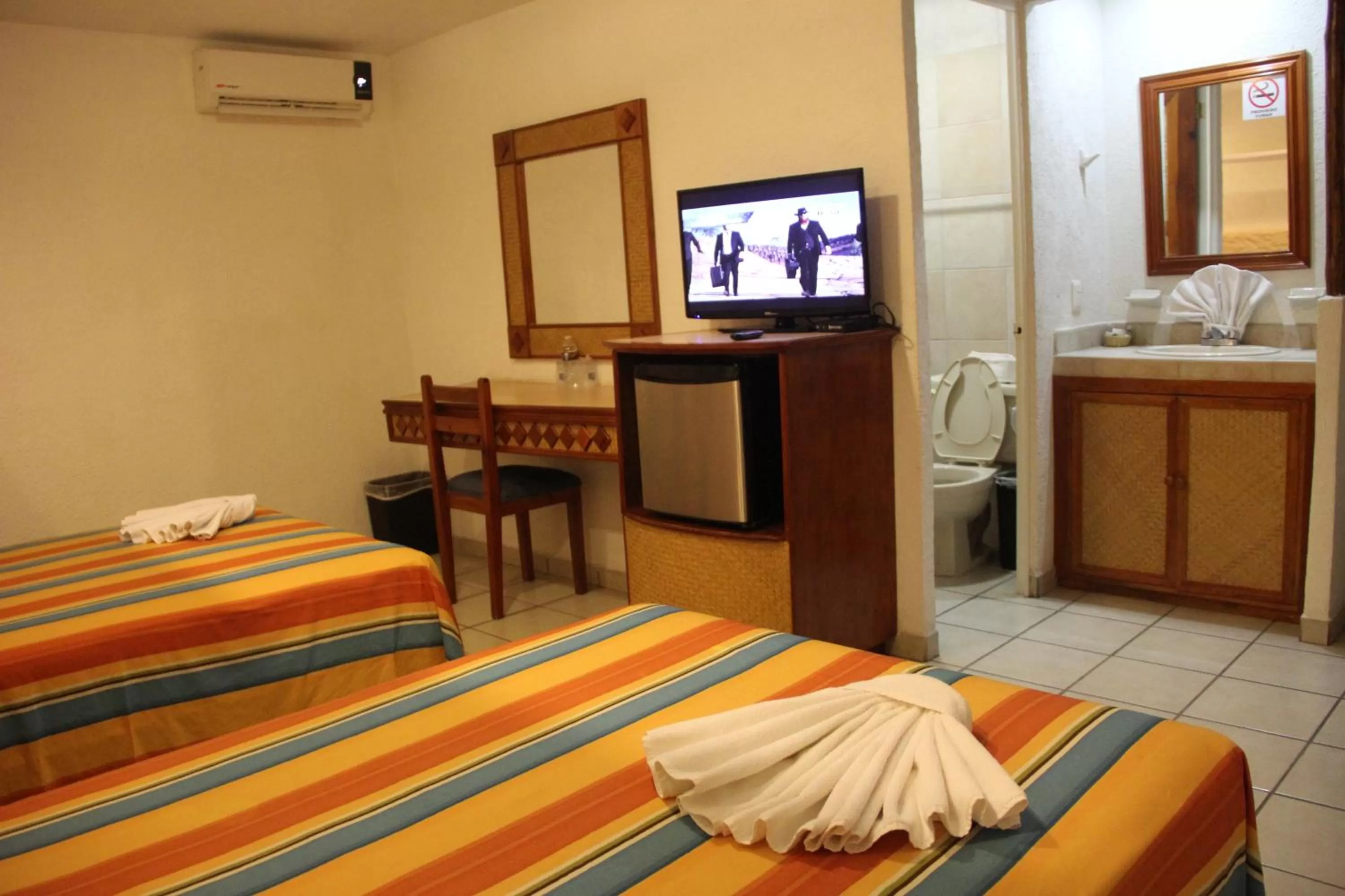 Bed in Hotel Palapa Palace