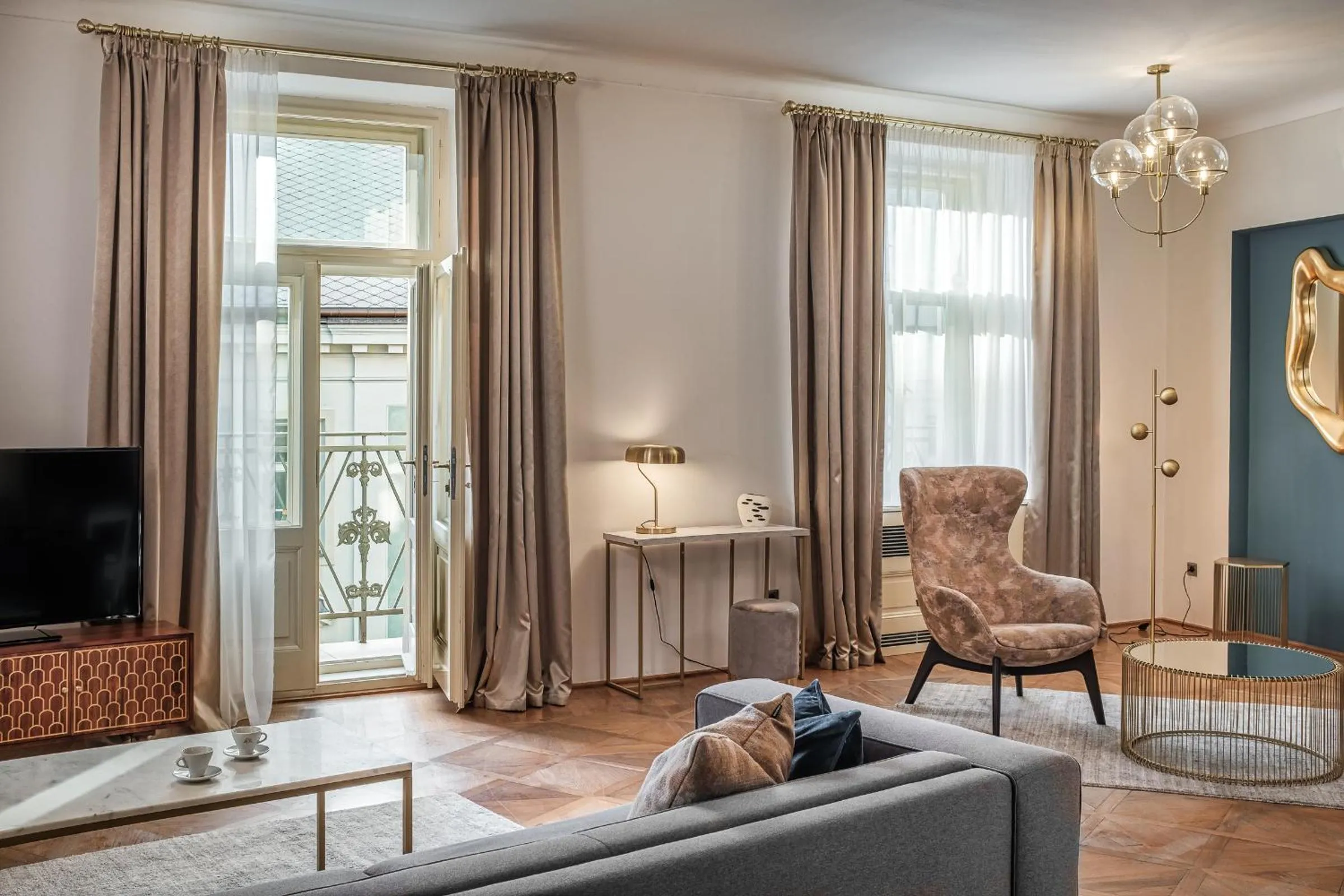 Seating area in Golden Angel Suites by Adrez