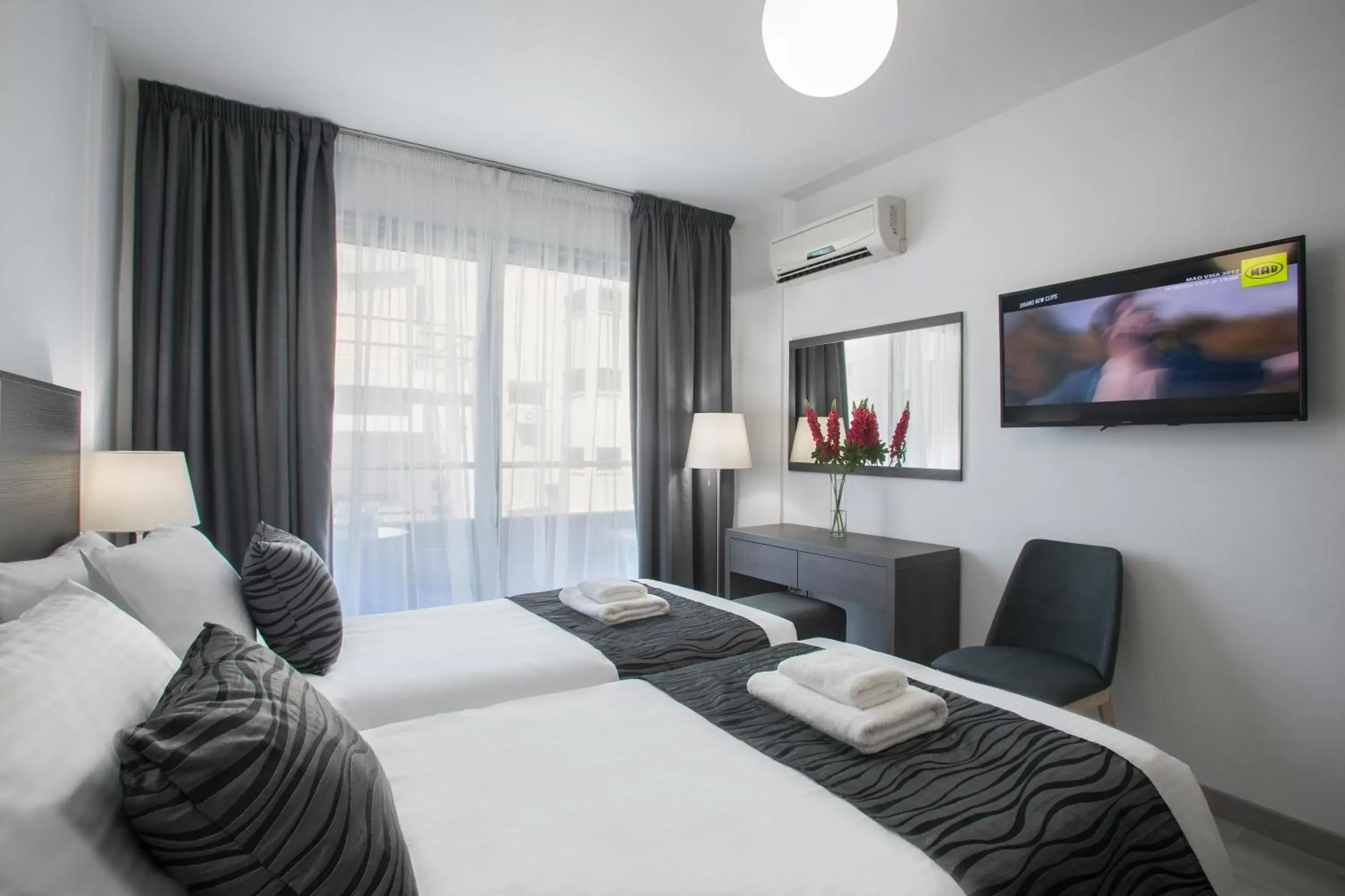 Bedroom, TV/Entertainment Center in Blazer Residence