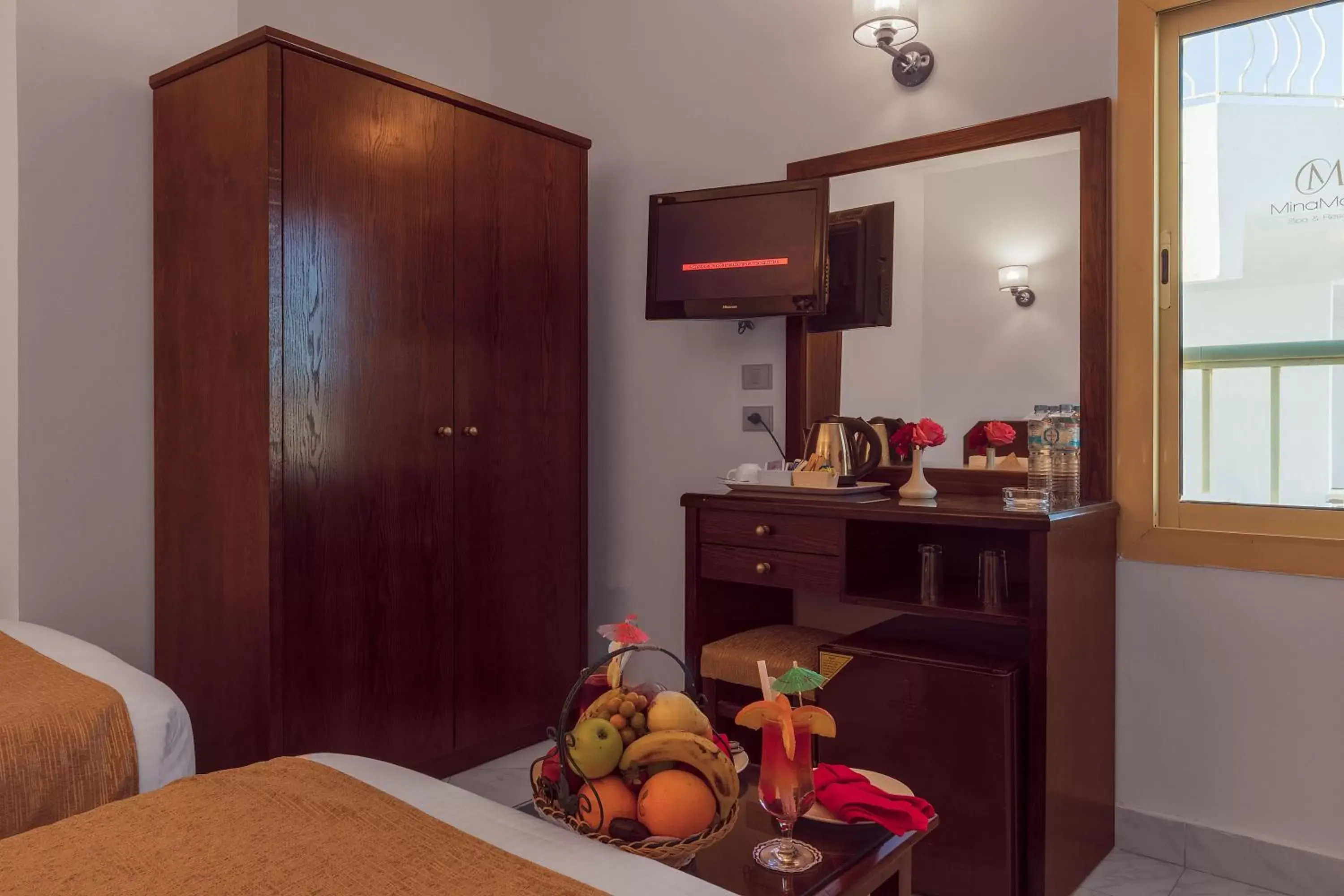 Coffee/tea facilities, TV/Entertainment Center in MinaMark Beach Resort for Families and Couples Only