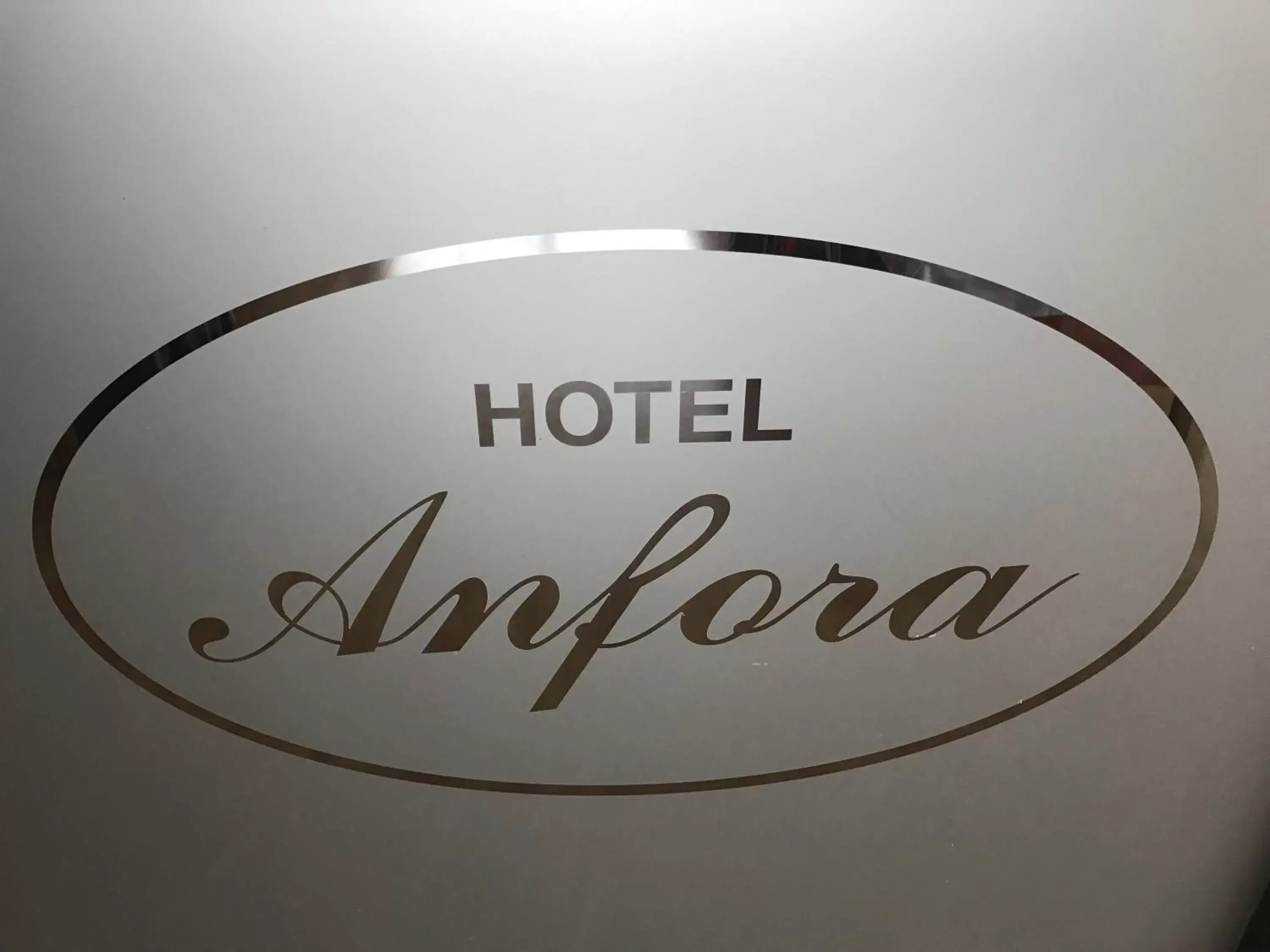 Property logo or sign in Hotel Anfora