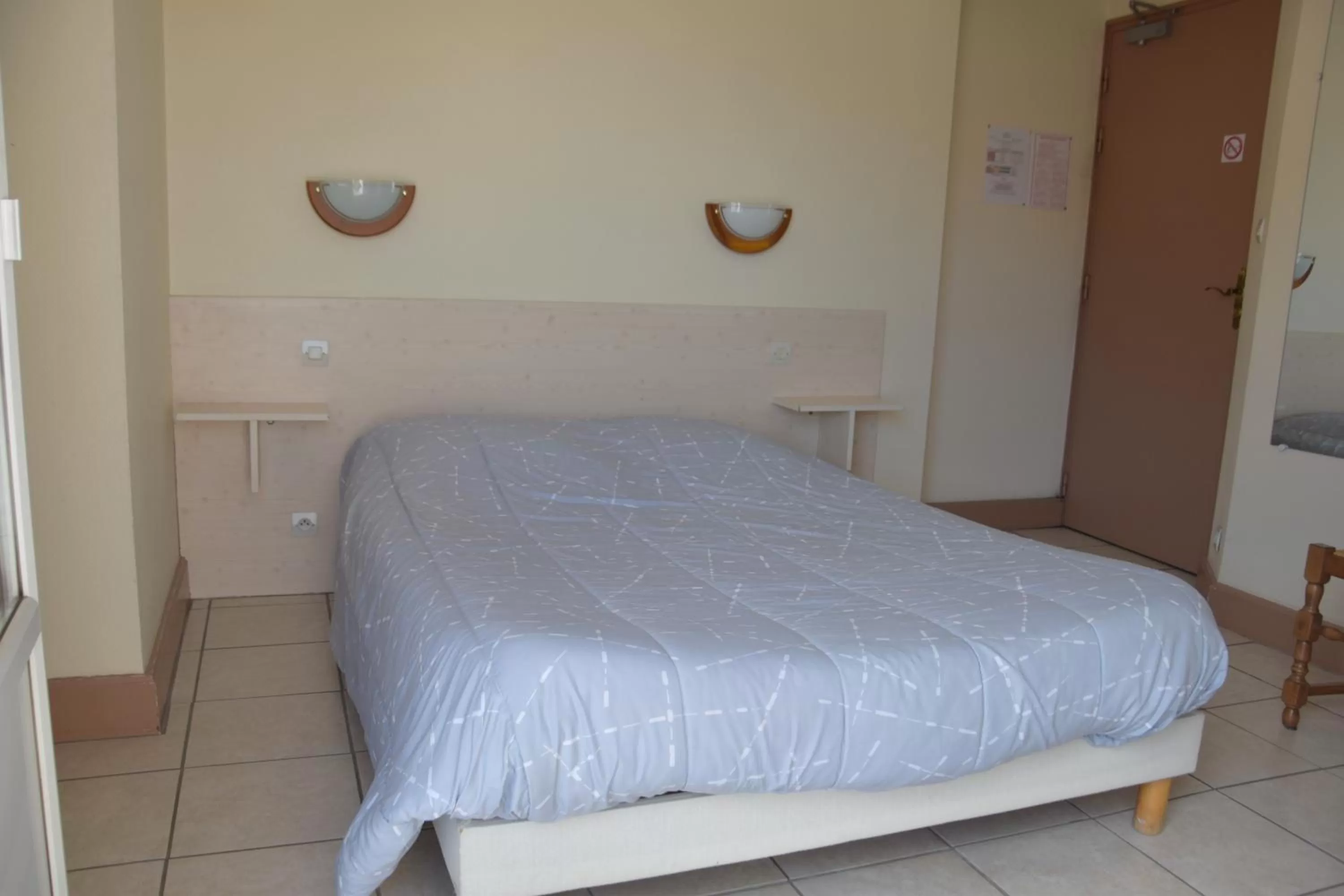 Bed in Hotel Gai Relais