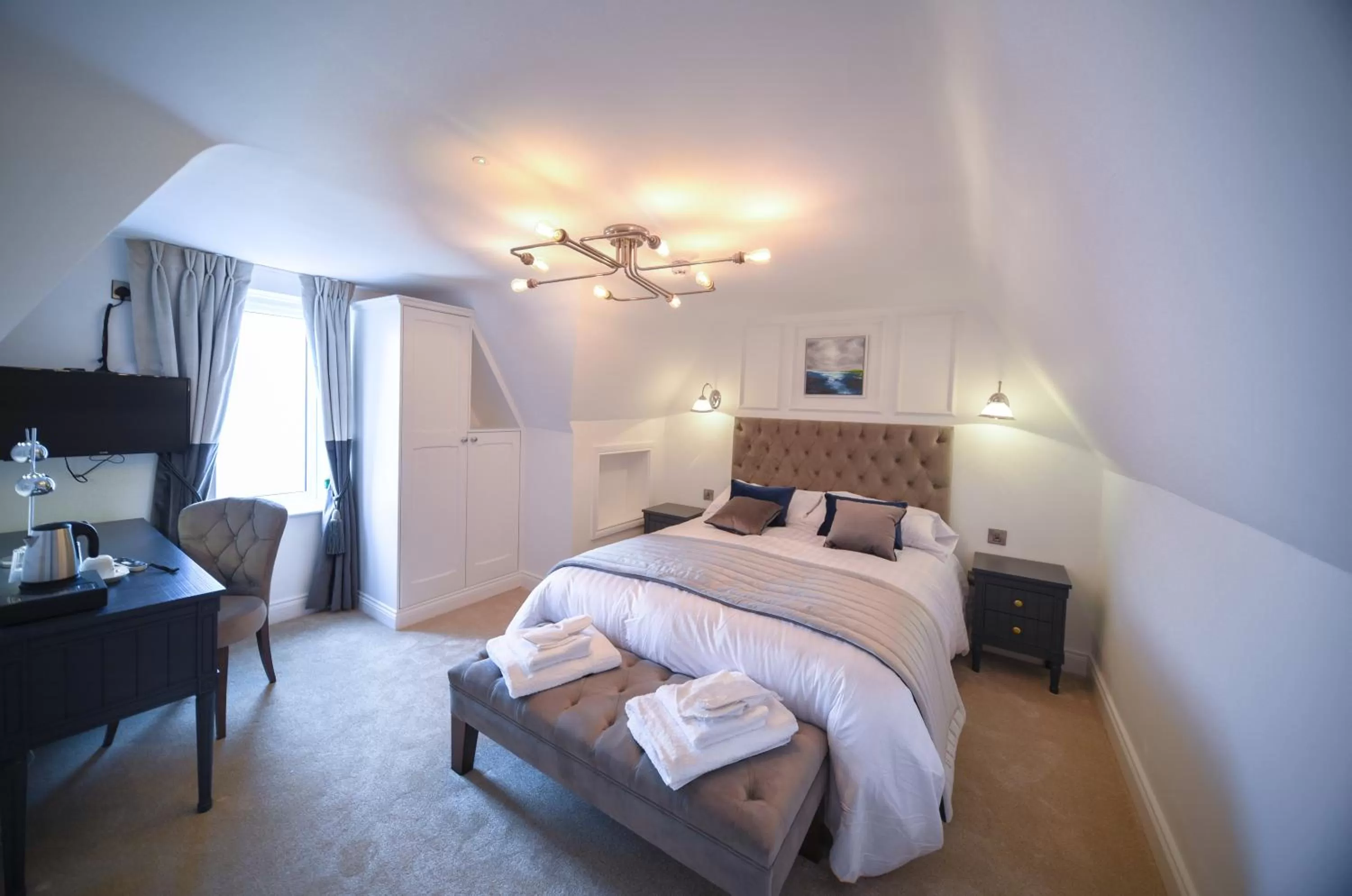 Photo of the whole room, Bed in The Strand Hotel, the former residence of Oscar Wilde