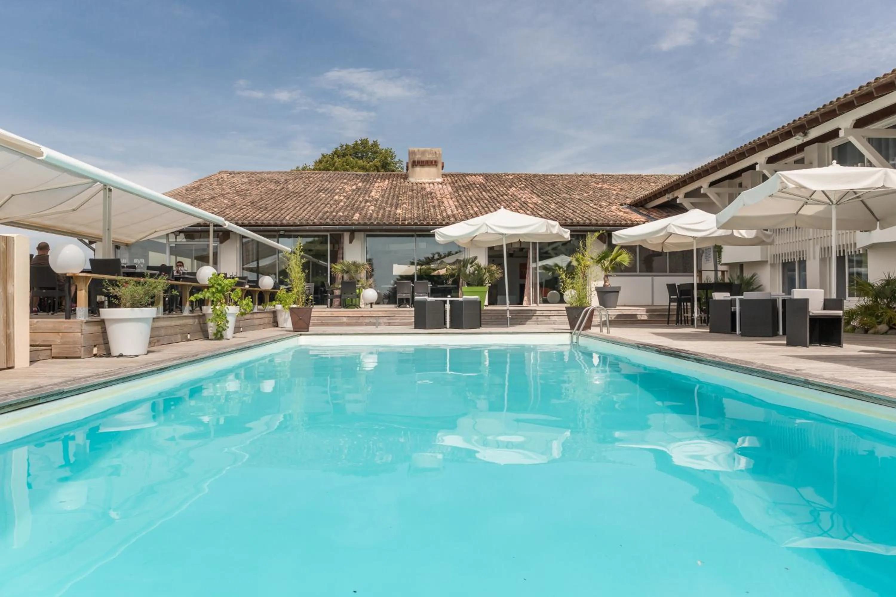 Swimming pool in Logis Hôtel Restaurant La Citadelle