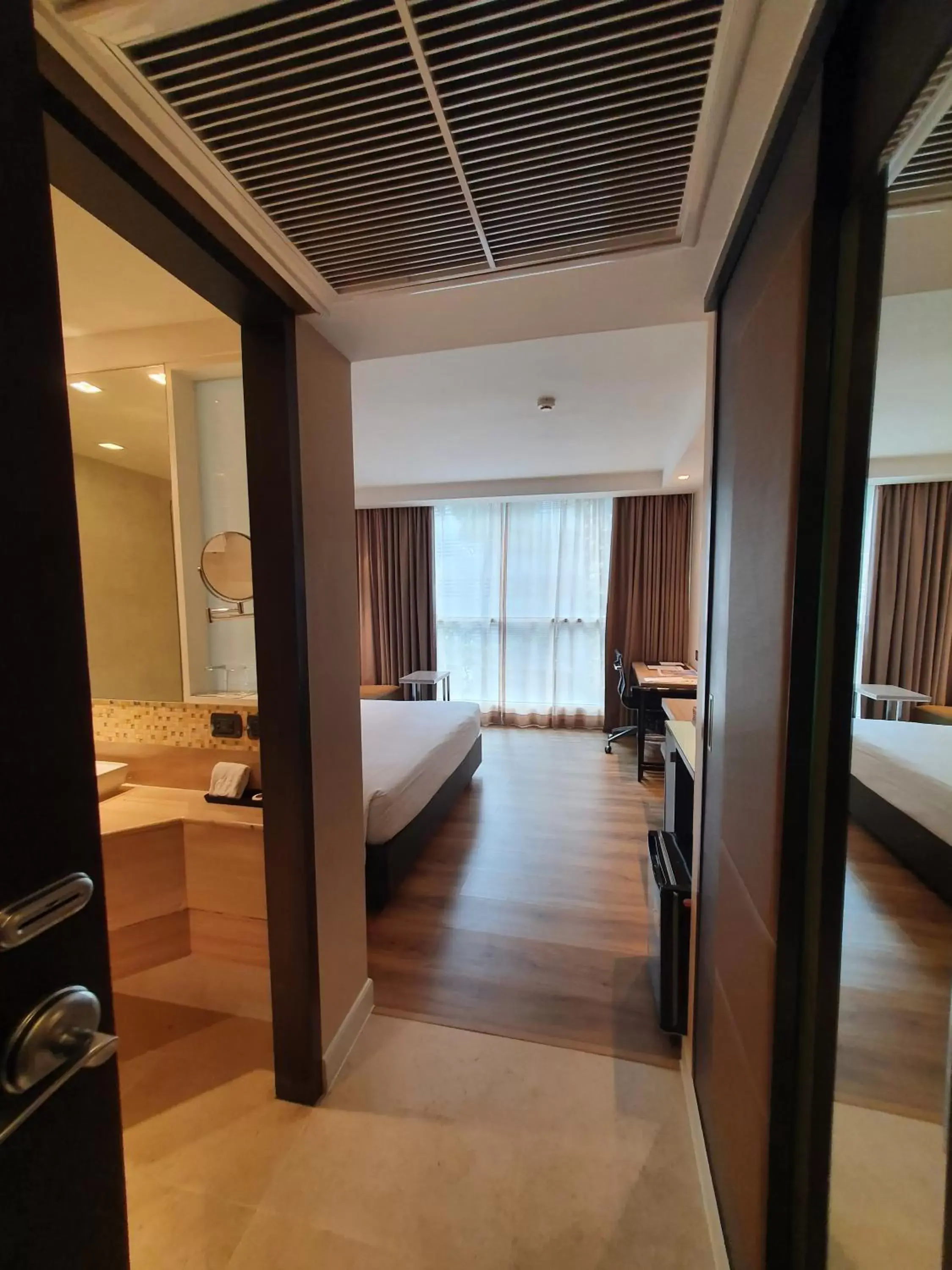 Photo of the whole room, Bathroom in Amora NeoLuxe Suites Hotel