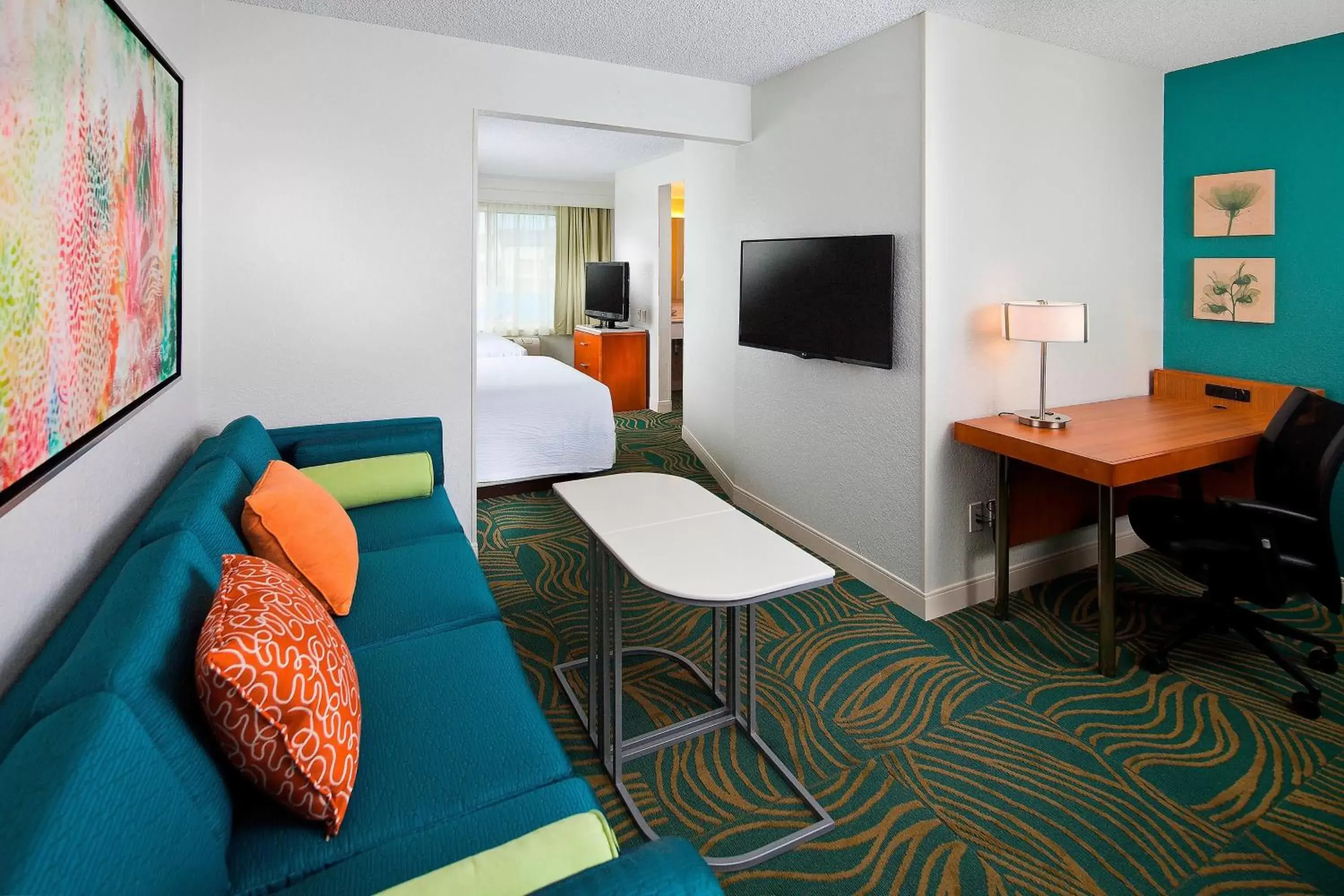 Photo of the whole room, TV/Entertainment Center in SpringHill Suites by Marriott Orlando Lake Buena Vista in Marriott Village
