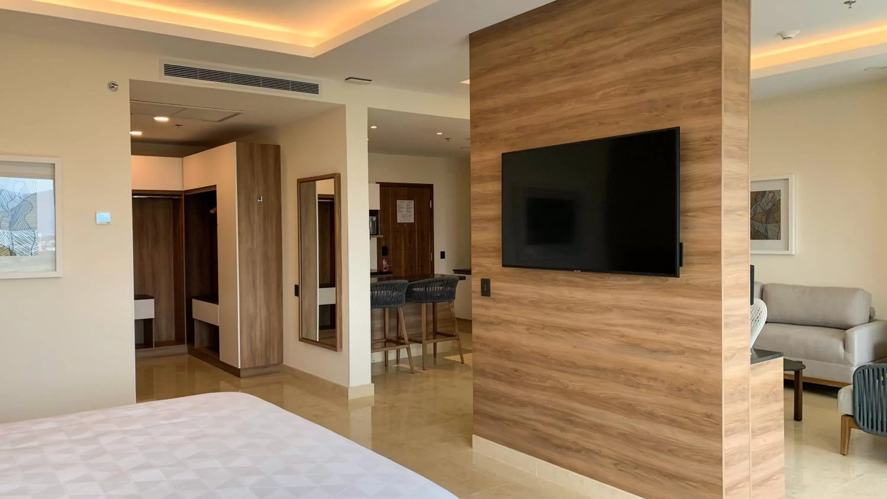 Photo of the whole room, TV/Entertainment Center in Holiday Inn & Suites - Puerto Vallarta Marina & Golf, an IHG Hotel