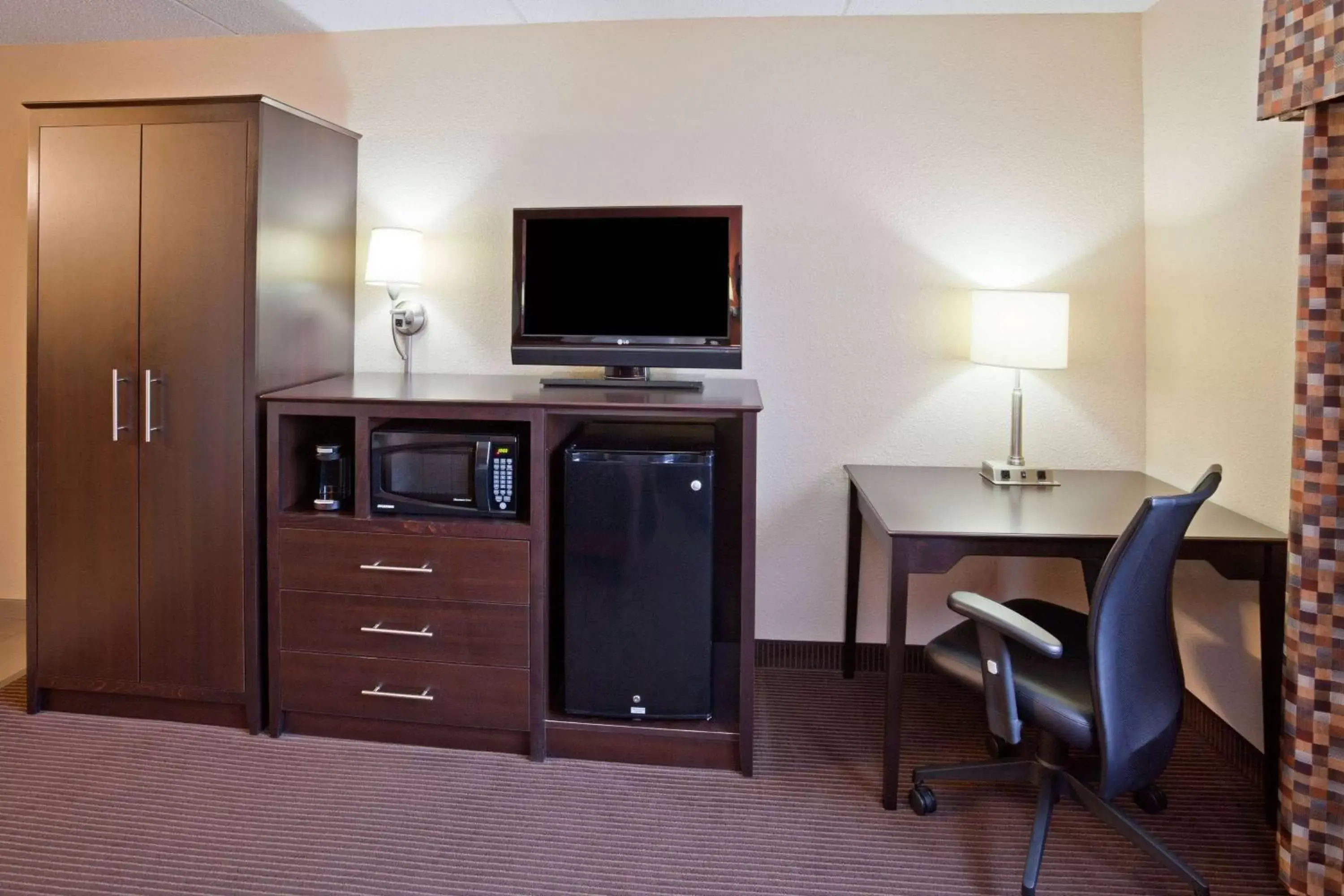 Photo of the whole room, TV/Entertainment Center in AmericInn by Wyndham Plover Stevens Point