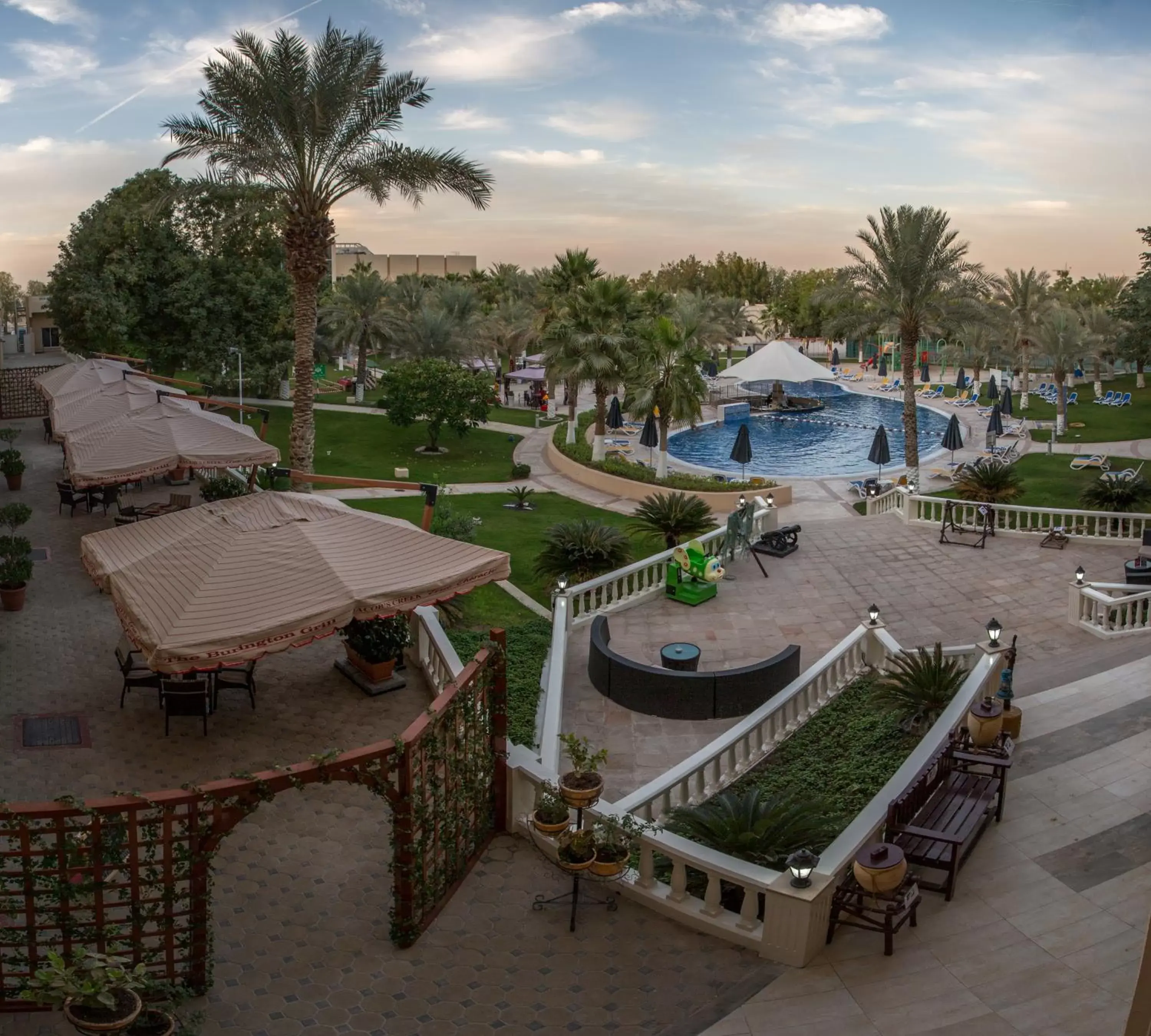 Garden, Pool View in Millennium Central Al Mafraq