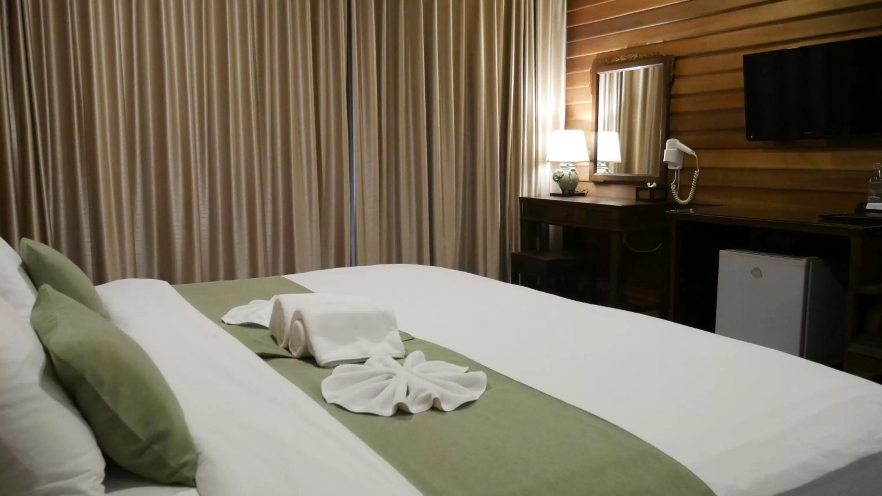 Bed in Royal River Kwai Resort and Spa