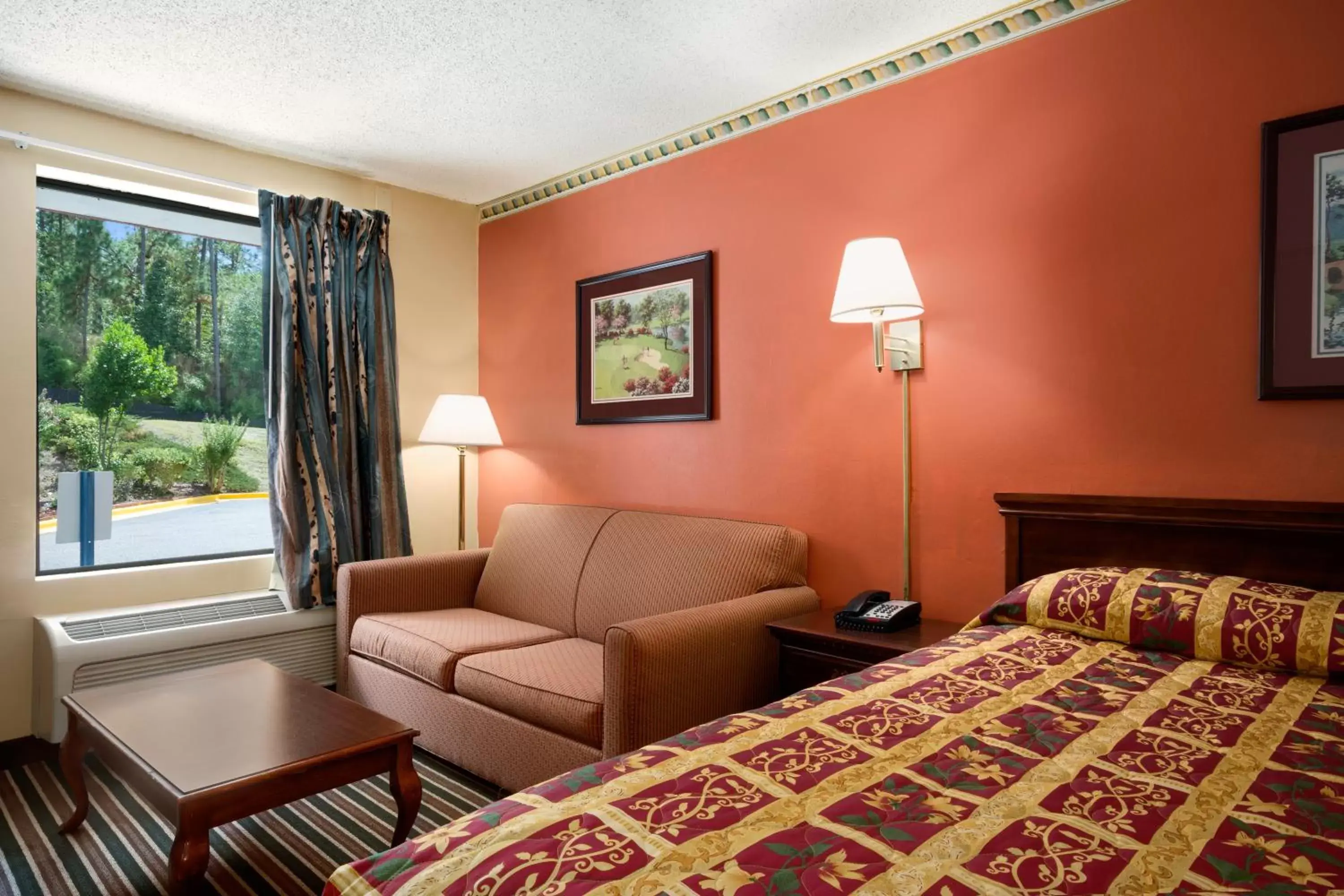 Seating area, Bed in Knights Inn Aiken