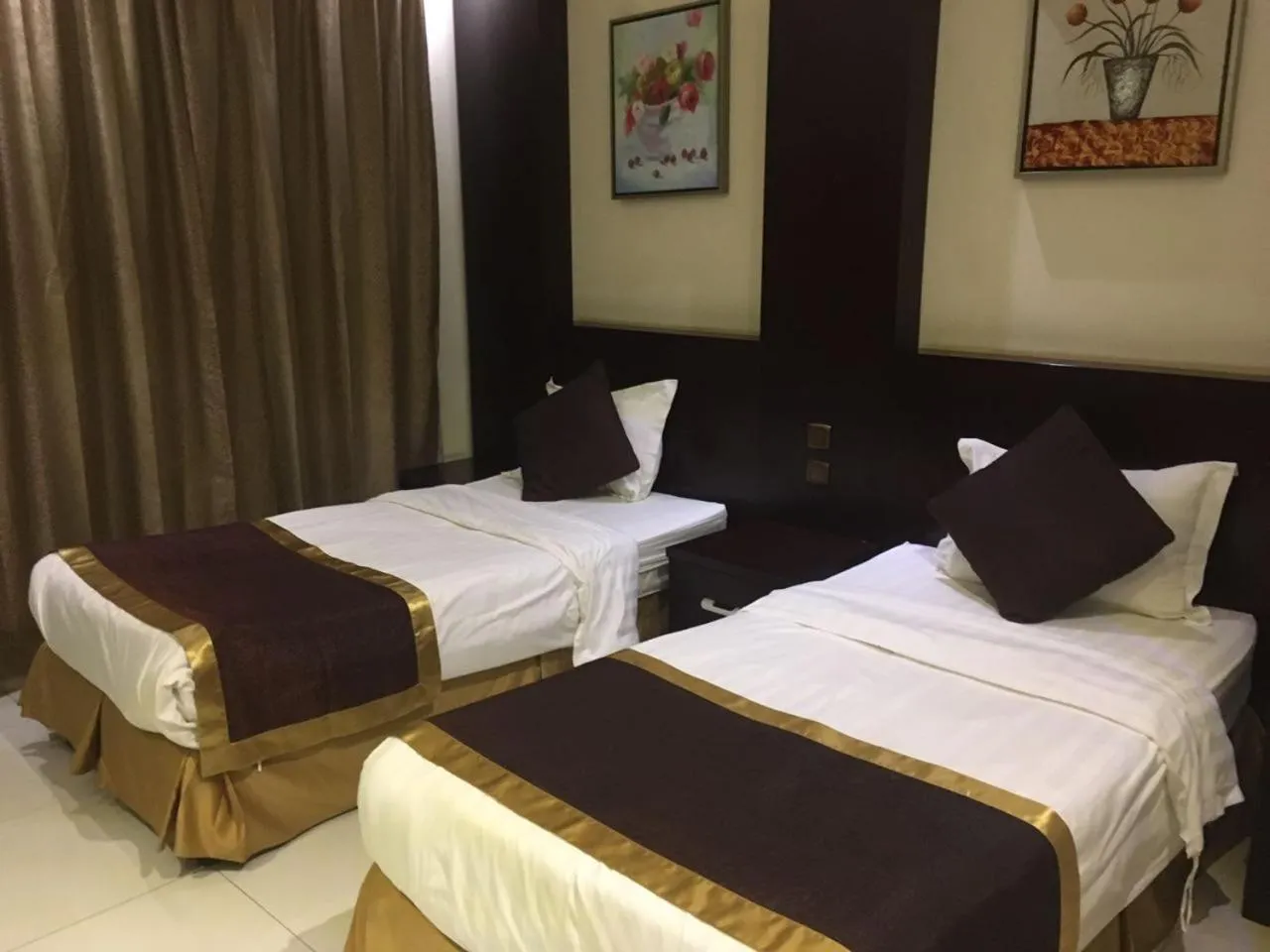 Bed in Taleen Al Nakheel Apartment