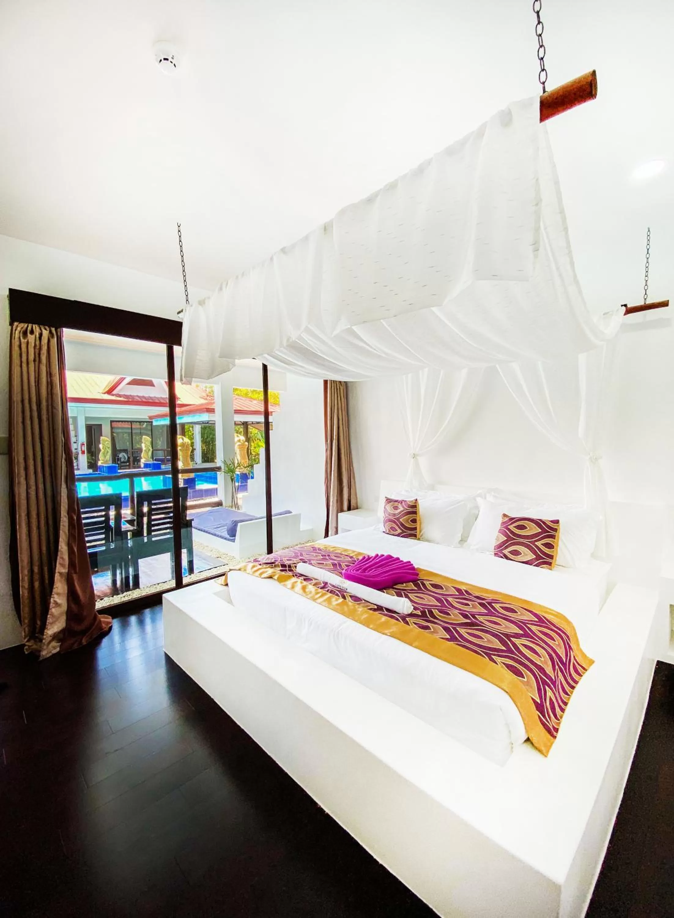 Bed in Carpe Diem Villas & Resort