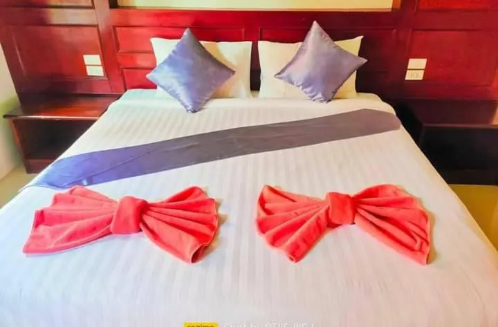 Bed in Tamarind Twin Resort