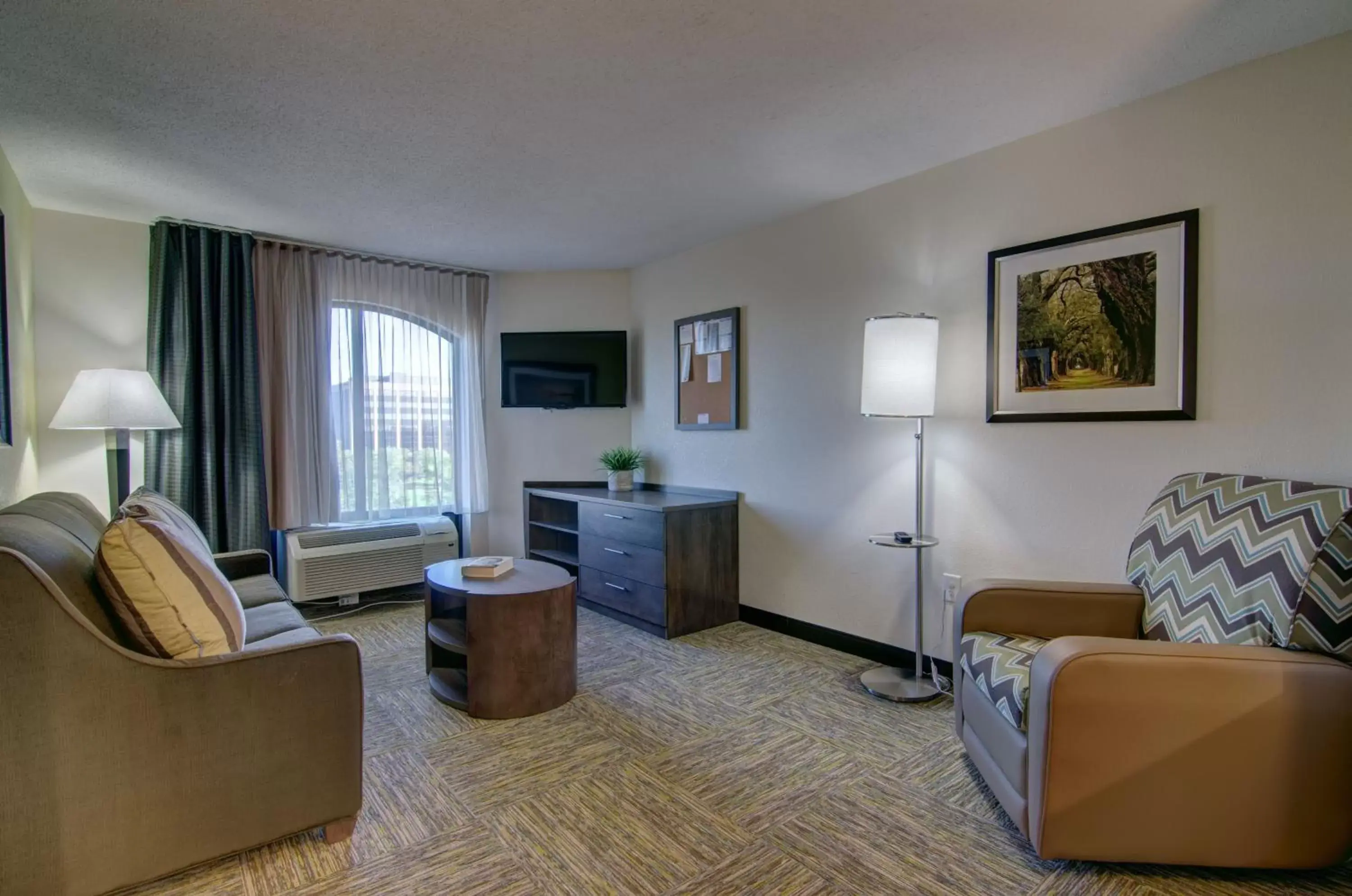 Bedroom, Seating Area in Candlewood Suites Richmond - West Broad, an IHG Hotel