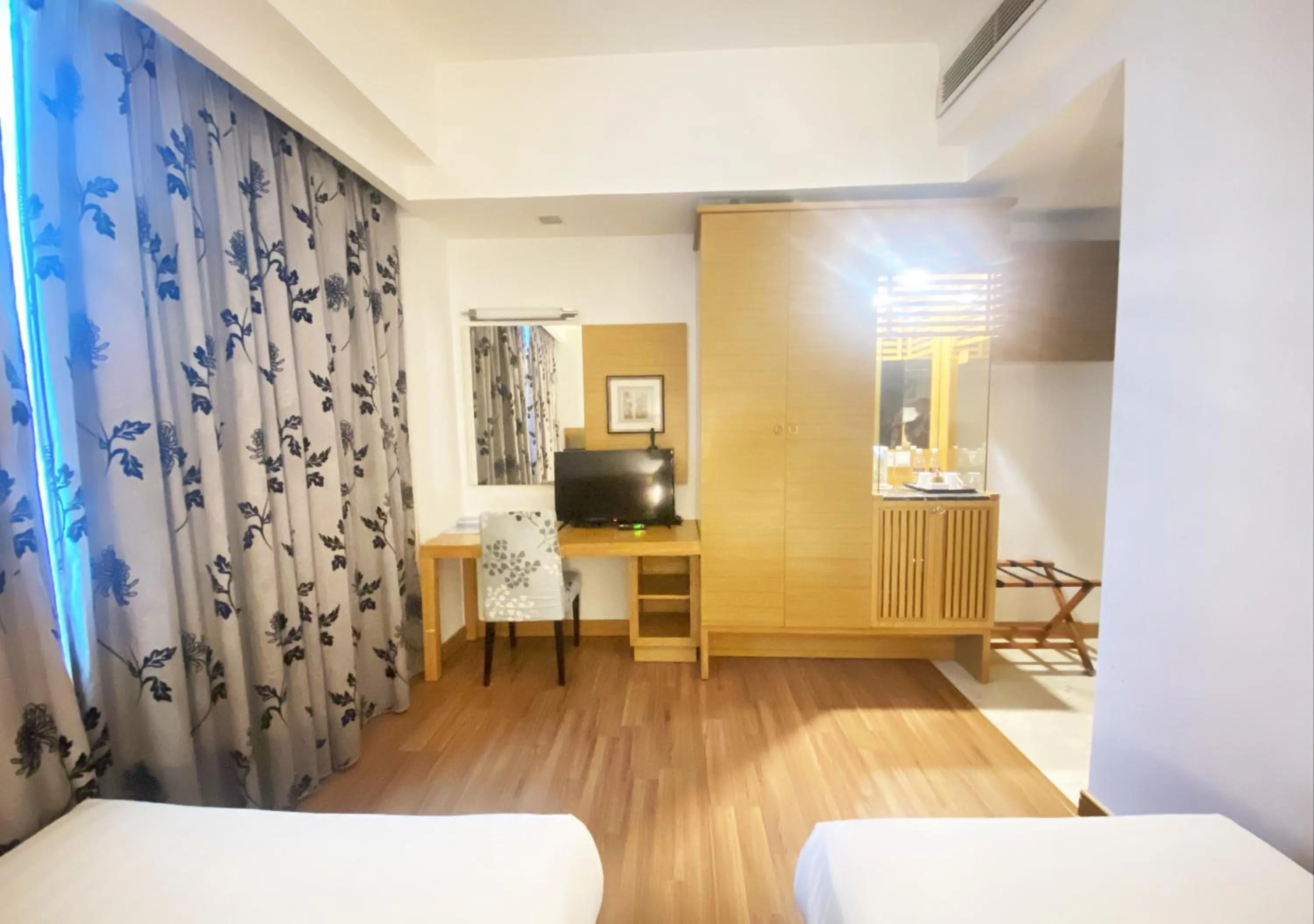 Bed in Crown Garden Hotel