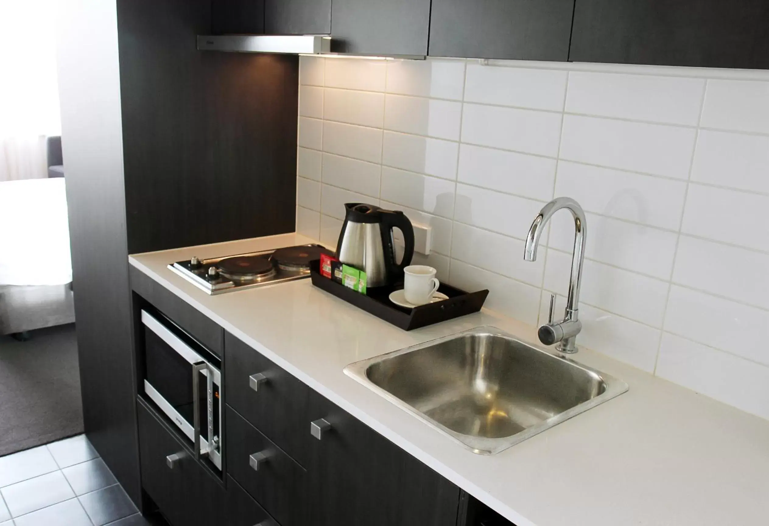 Kitchen or kitchenette, Kitchen/Kitchenette in Mercure Melbourne Therry Street