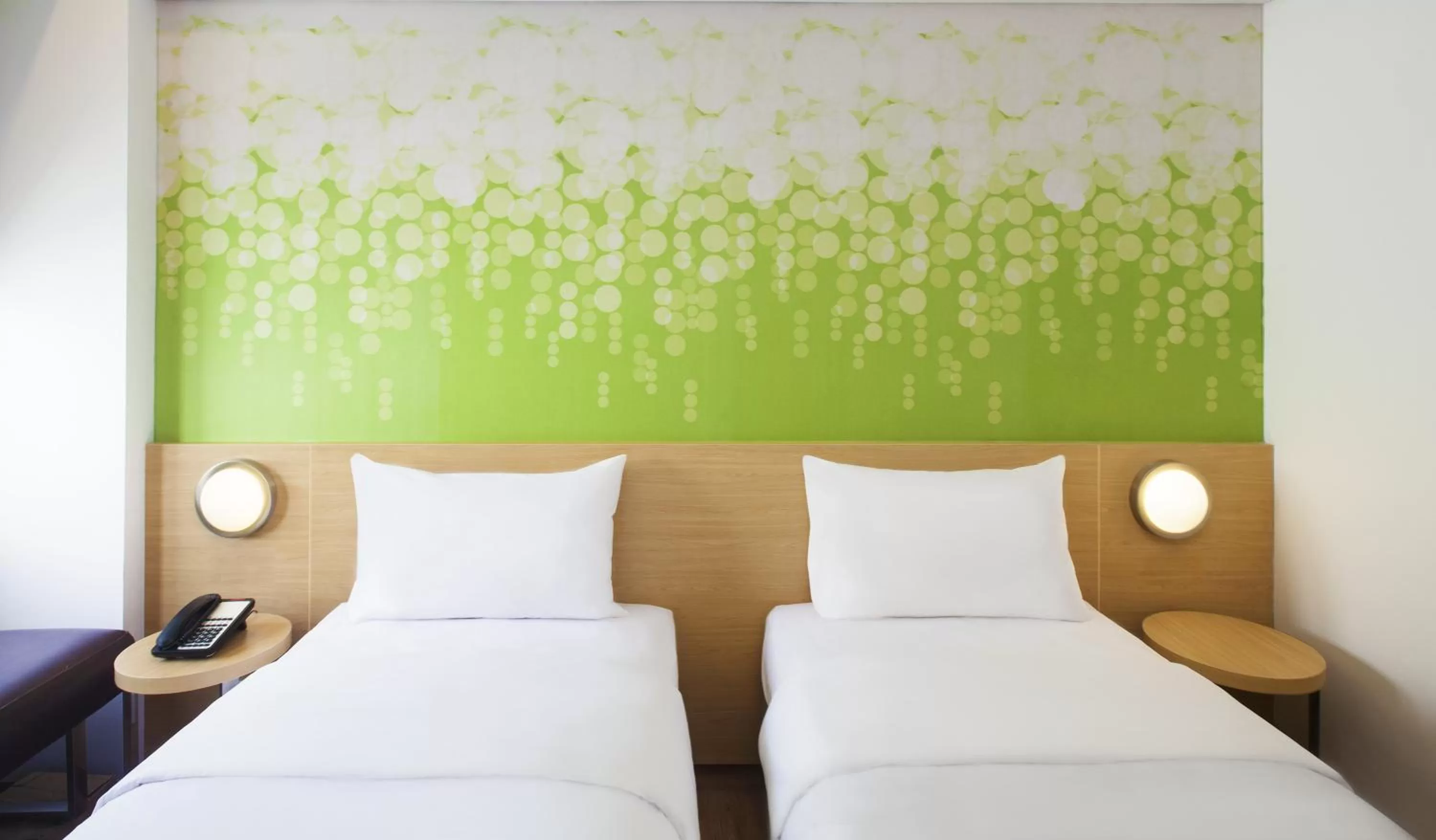 Bed in Zest Yogyakarta by Swiss-Belhotel International