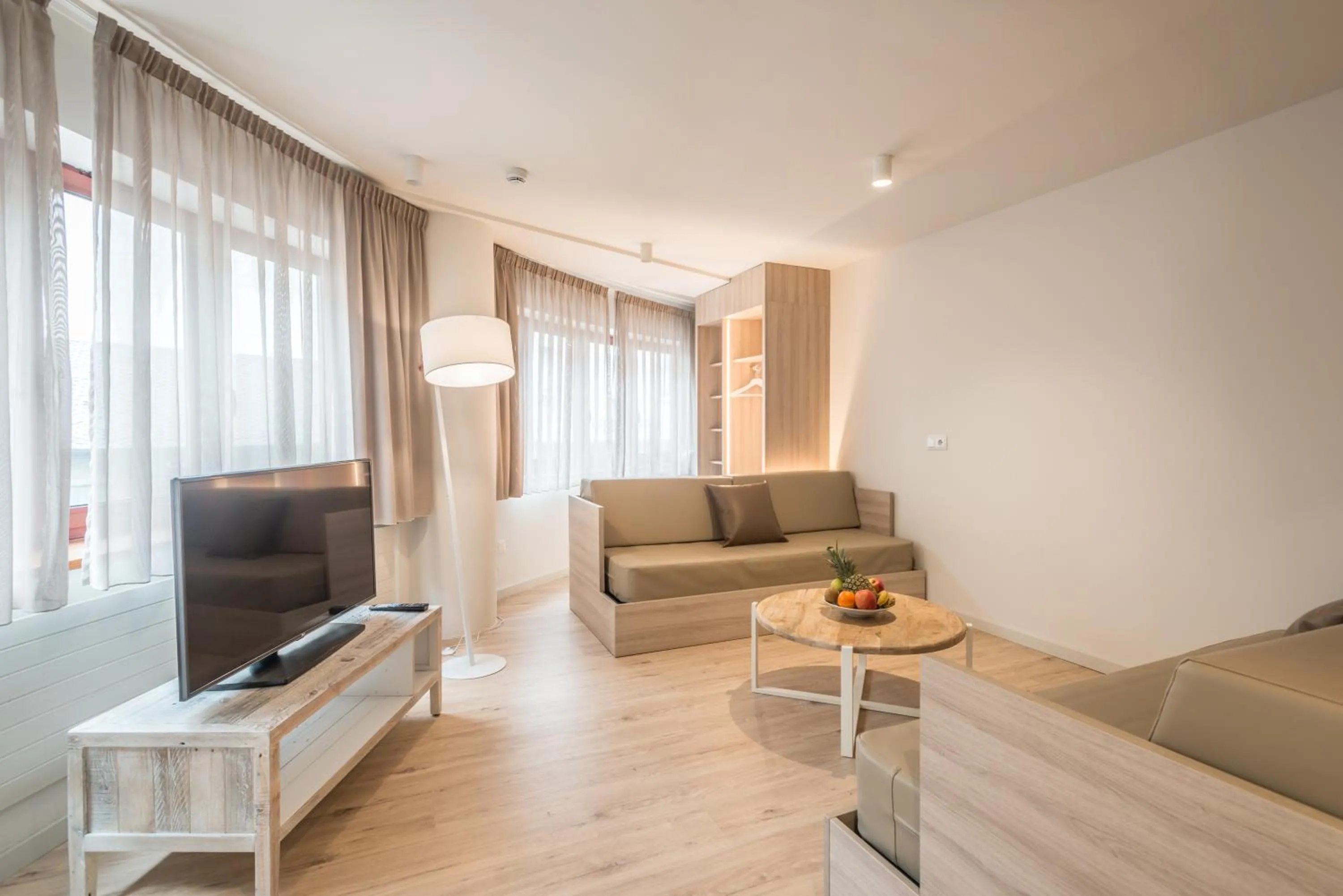 Communal lounge/ TV room in Hotel & Aparthotel Cosmos