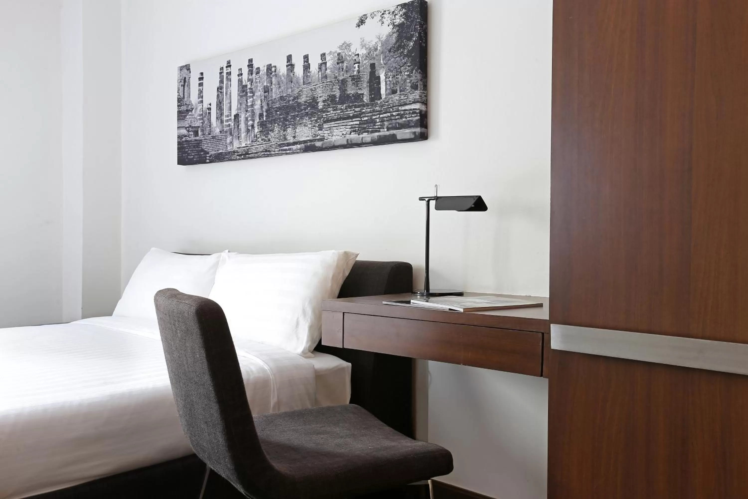 Bed in S33 Compact Sukhumvit Hotel