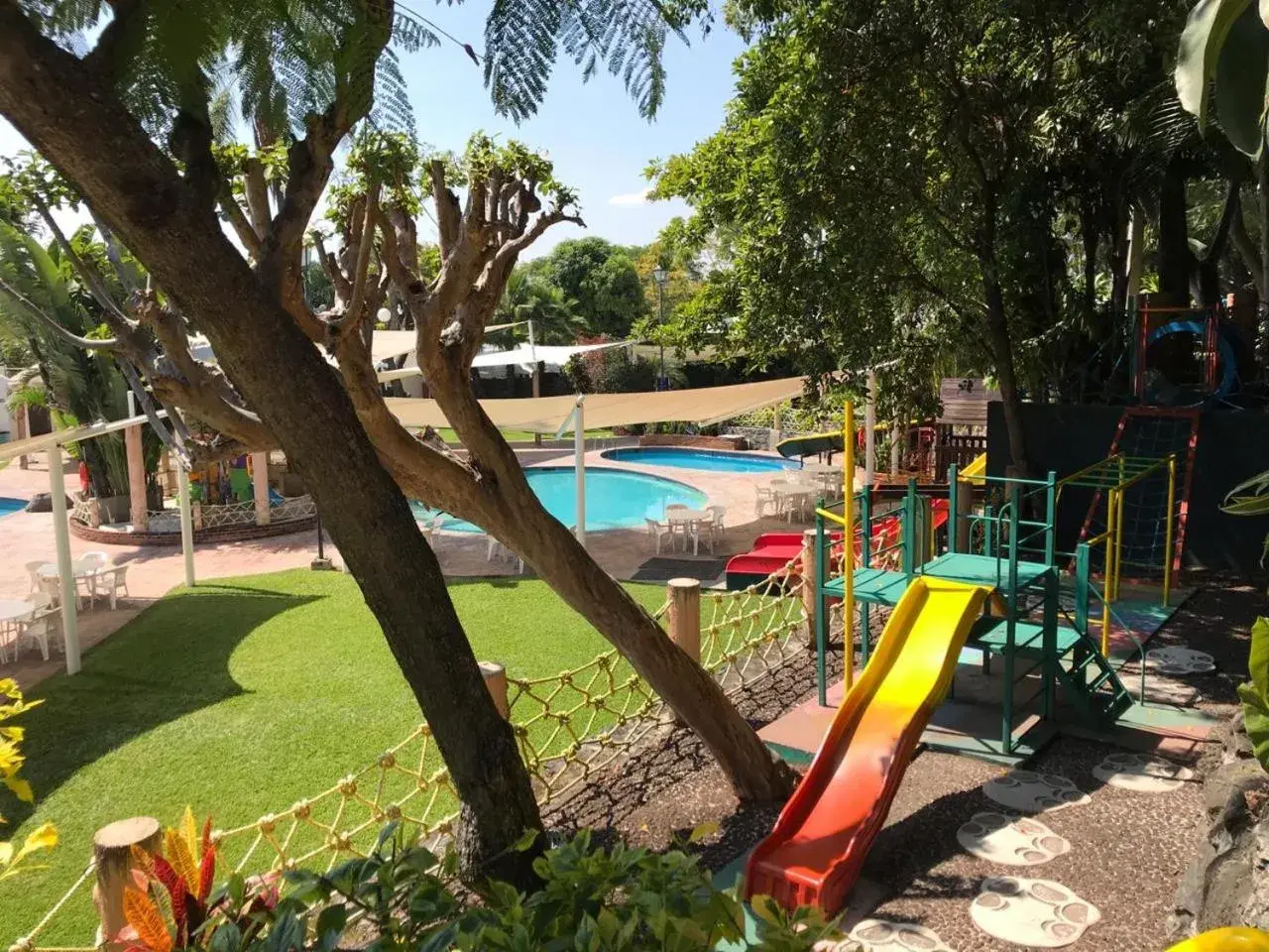 Children play ground, Swimming Pool in Hotel Coral Cuernavaca Resort & Spa