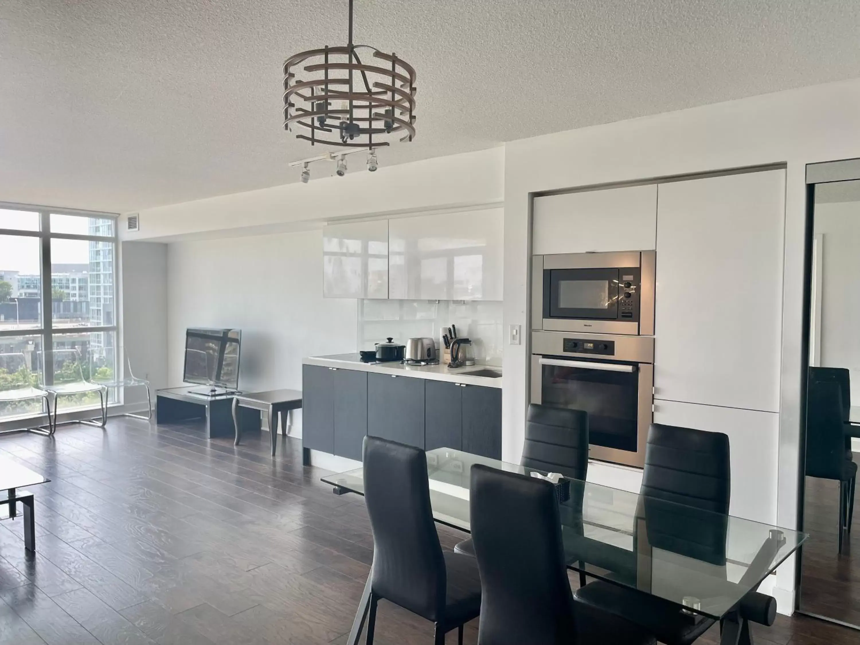 stove, Dining Area in Three BR Condo step to CN tower Rogers Center with Free parking