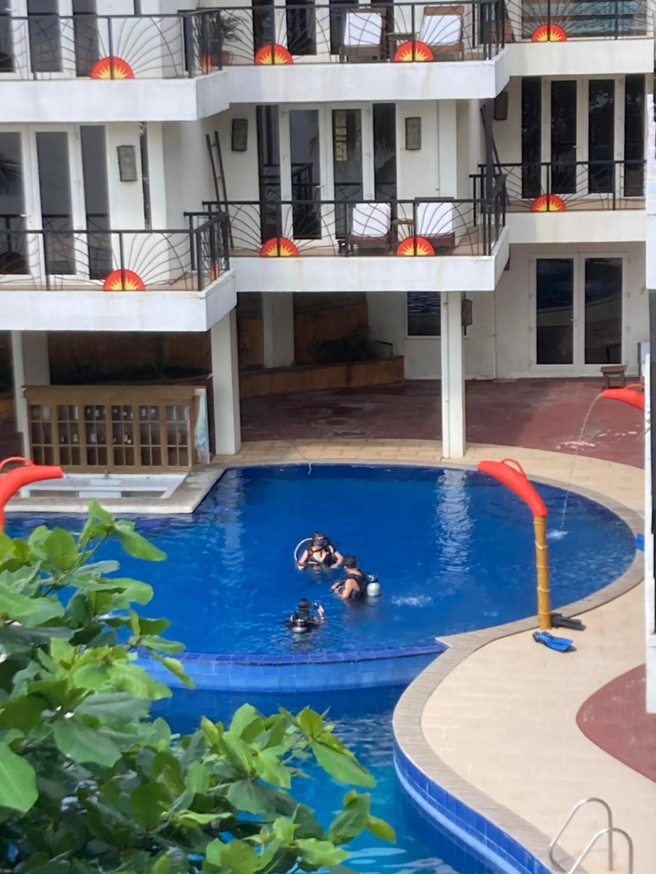 Swimming Pool in Sunset At Aninuan Beach Resort