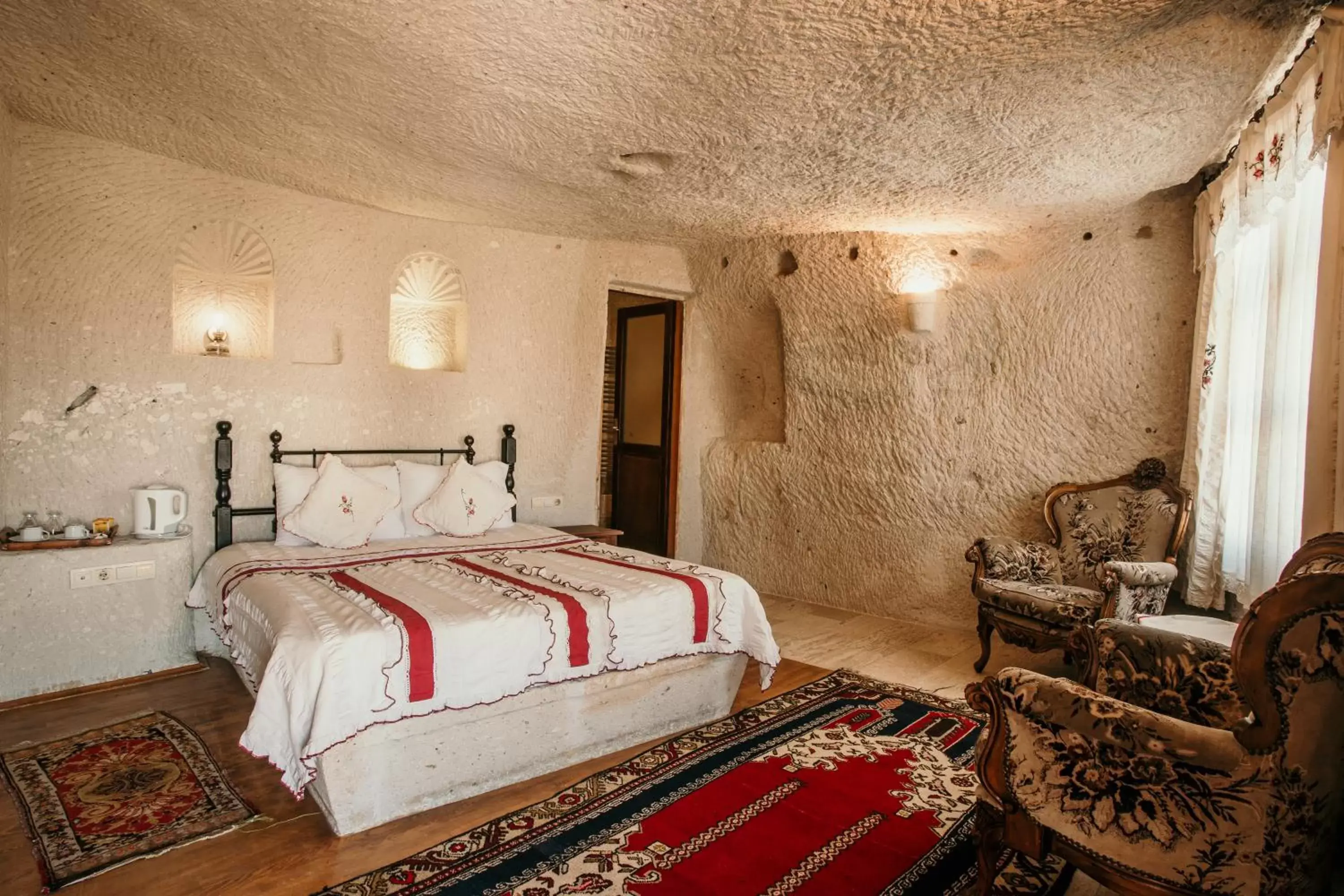 Bed in Village Cave House Hotel