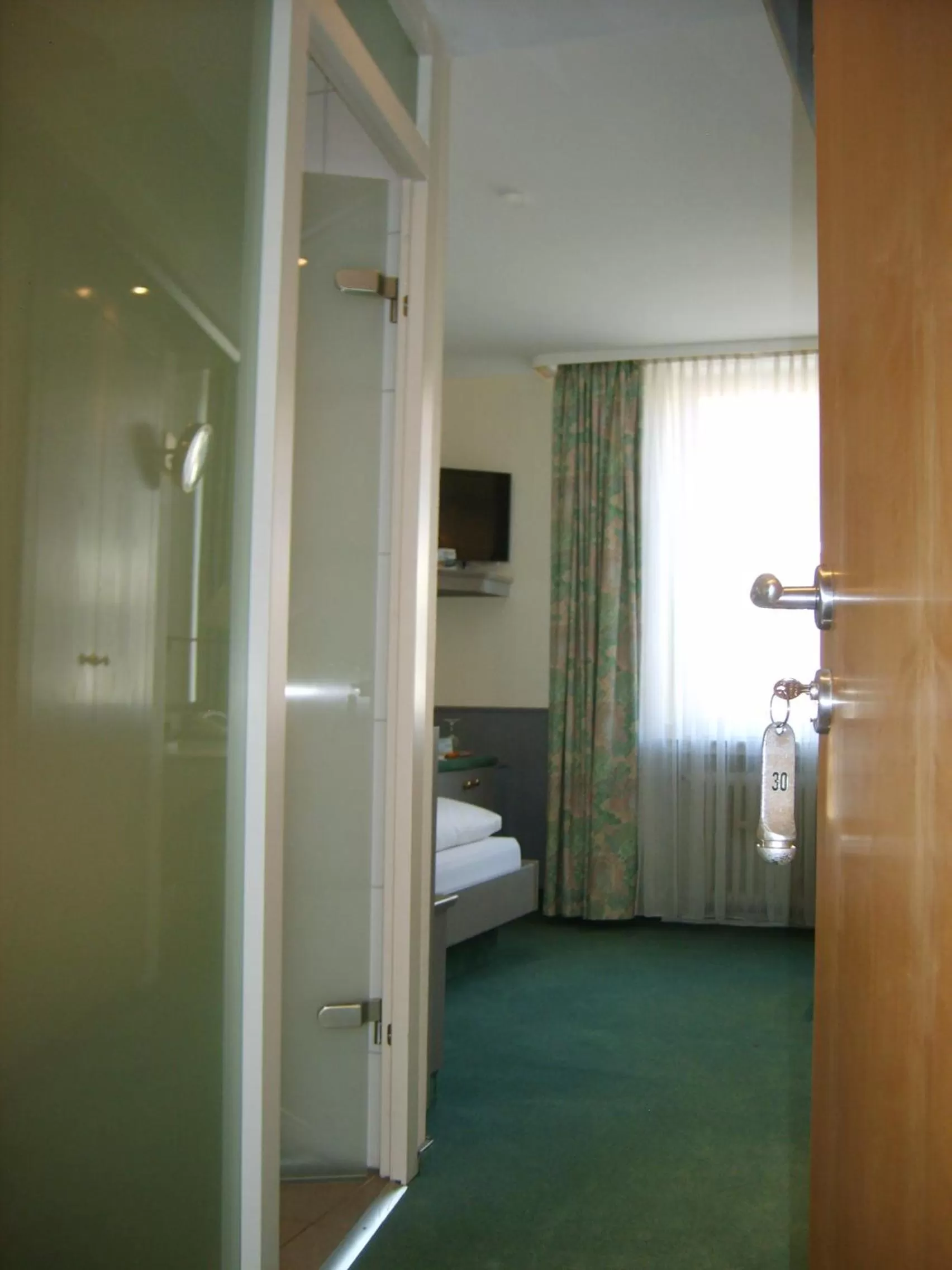 Photo of the whole room, Bed in City Hotel by celina