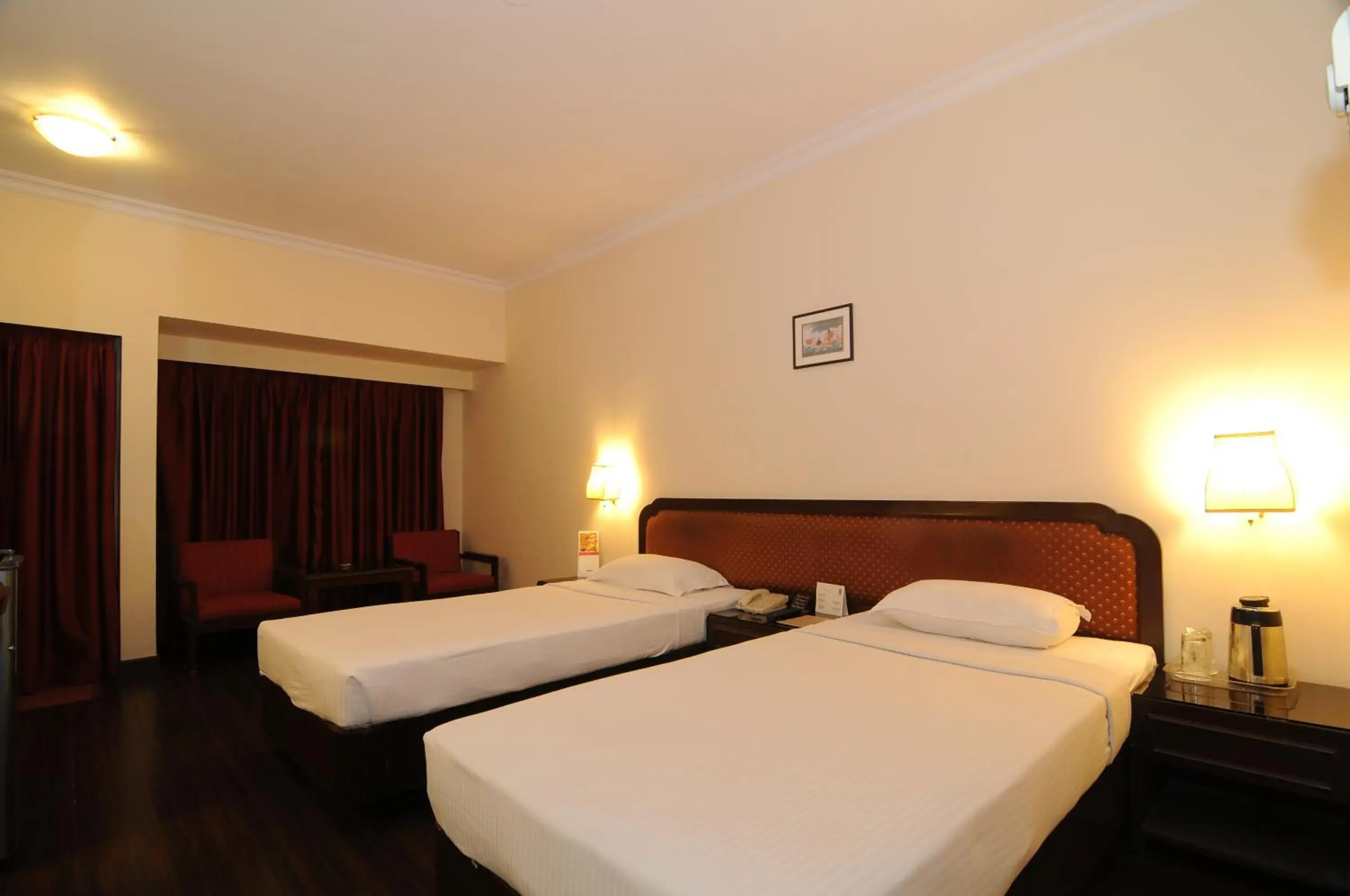 Bed in Quality Inn Regency, Nashik
