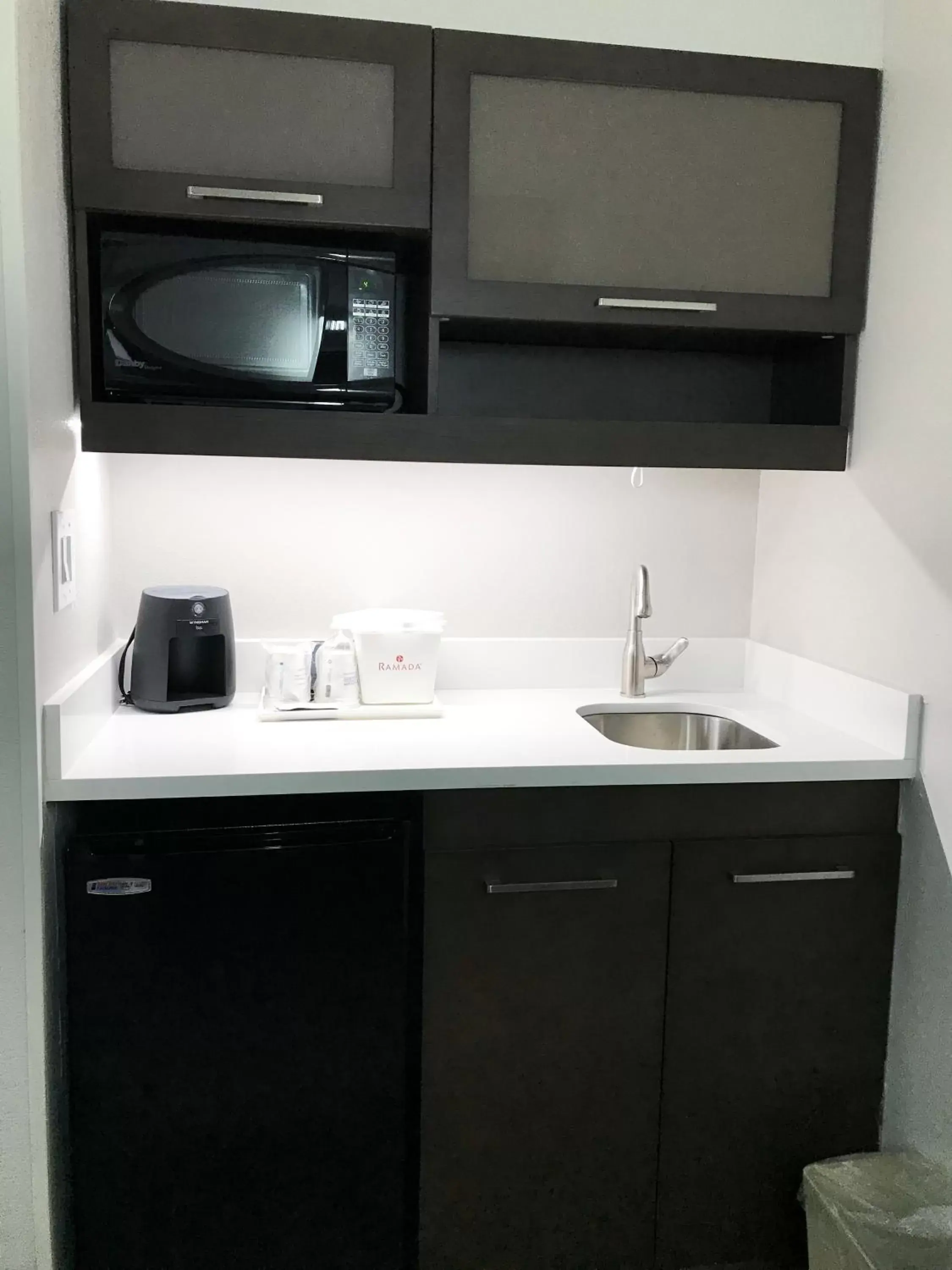 Kitchen or kitchenette, Bathroom in Ramada by Wyndham Suites Orlando Airport