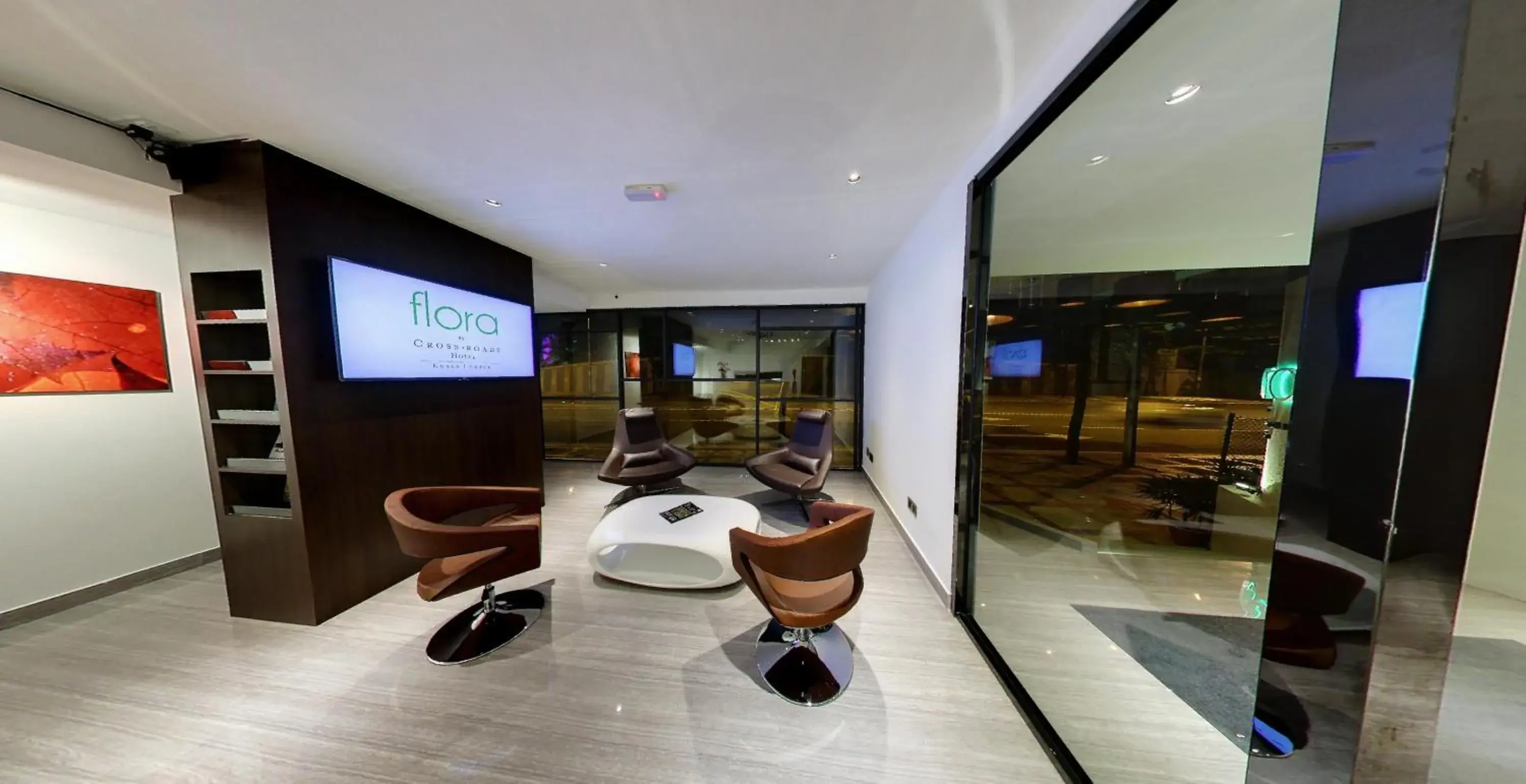 Communal lounge/ TV room, Lobby/Reception in Flora by Crossroads Hotel