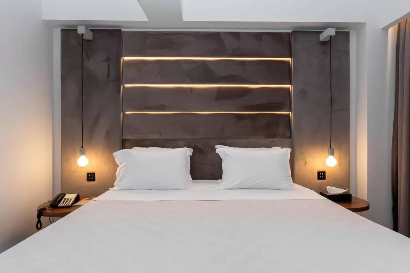 Bed in DOM Boutique Hotel