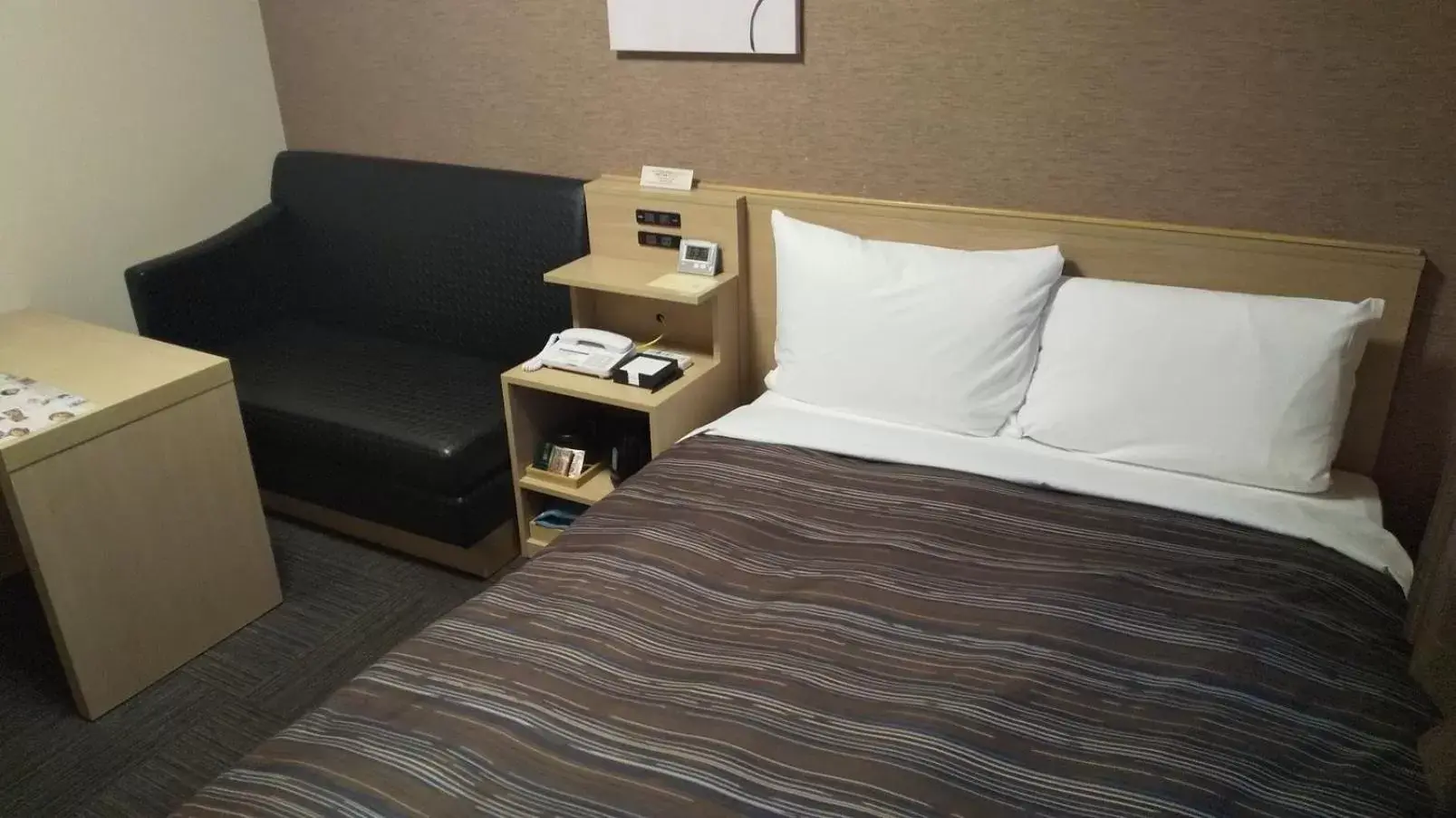 Bed in Hotel Route-Inn Higashiomi Yokaichi Ekimae