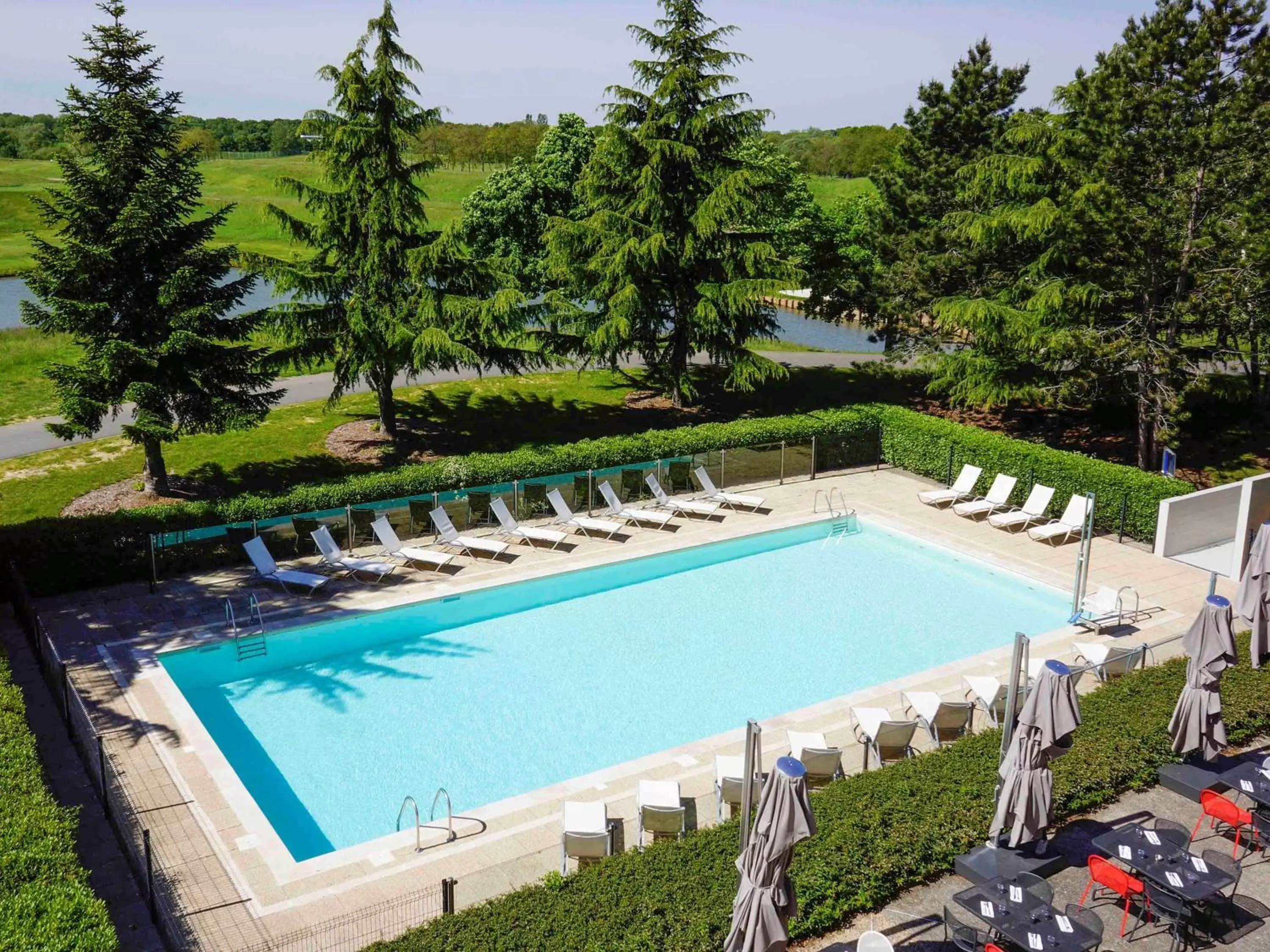 Photo of the whole room, Pool View in Novotel Saint-Quentin en Yvelines