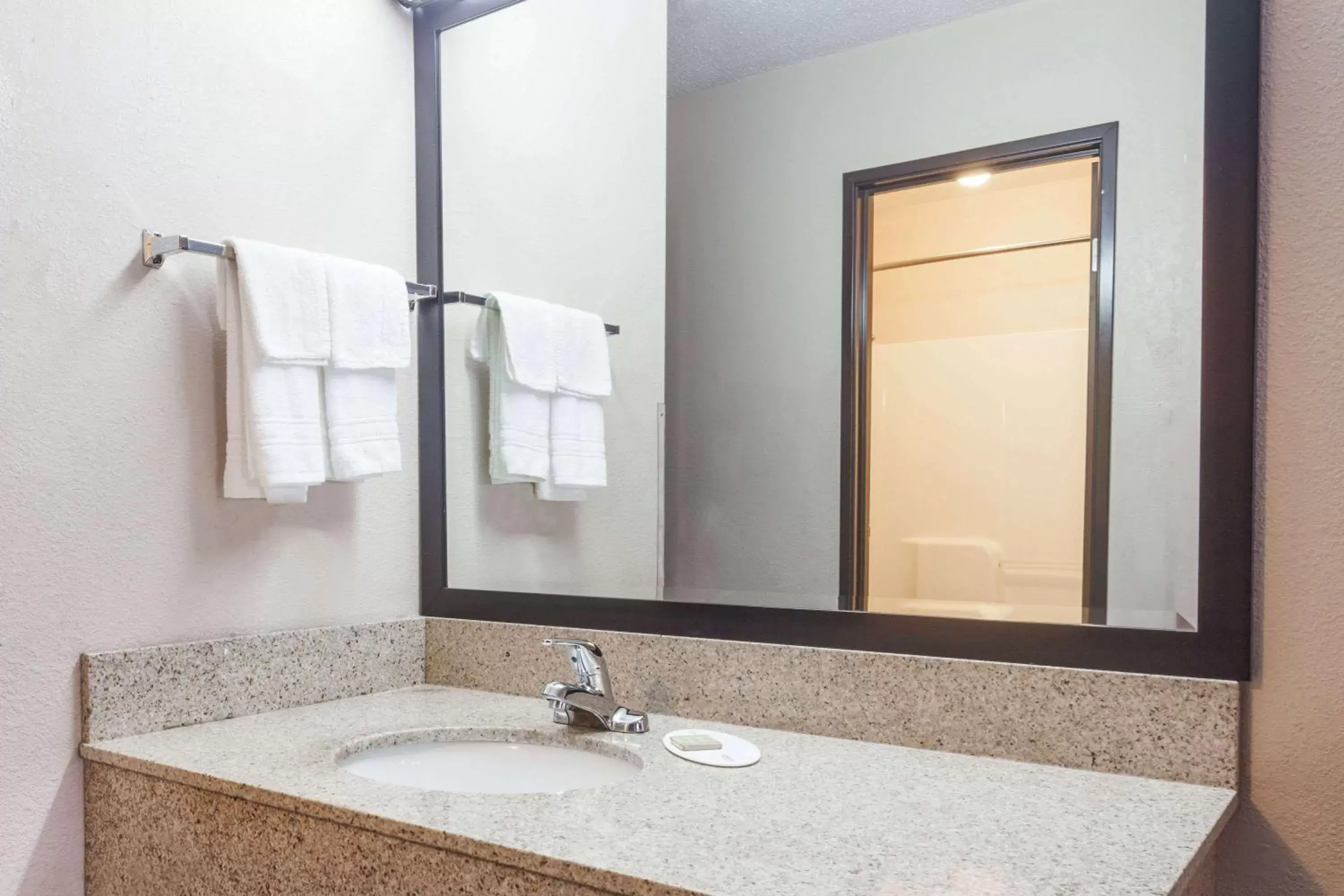 Bathroom in Super 8 by Wyndham Carrollton