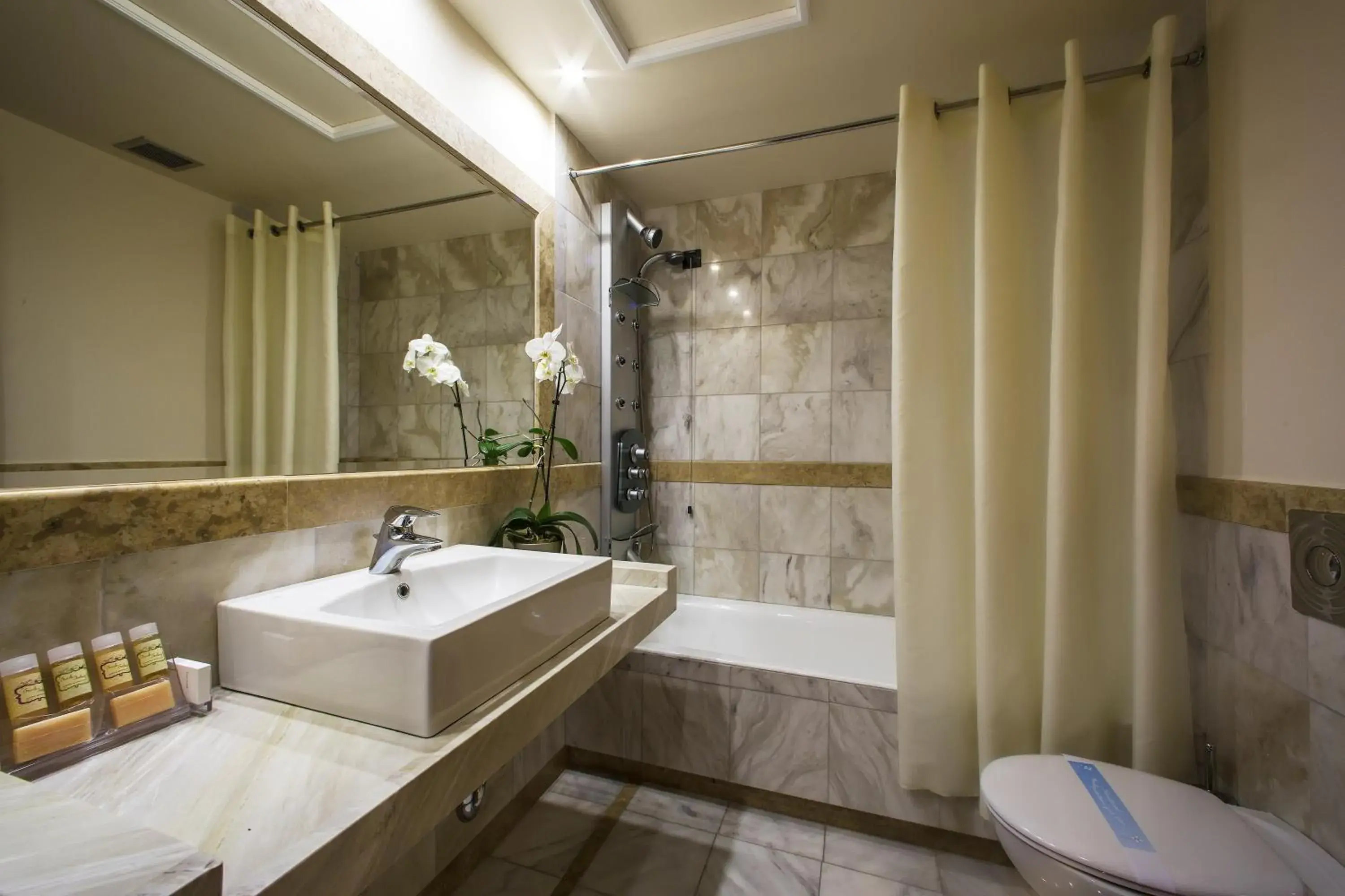 Bathroom in Dekelia Hotel