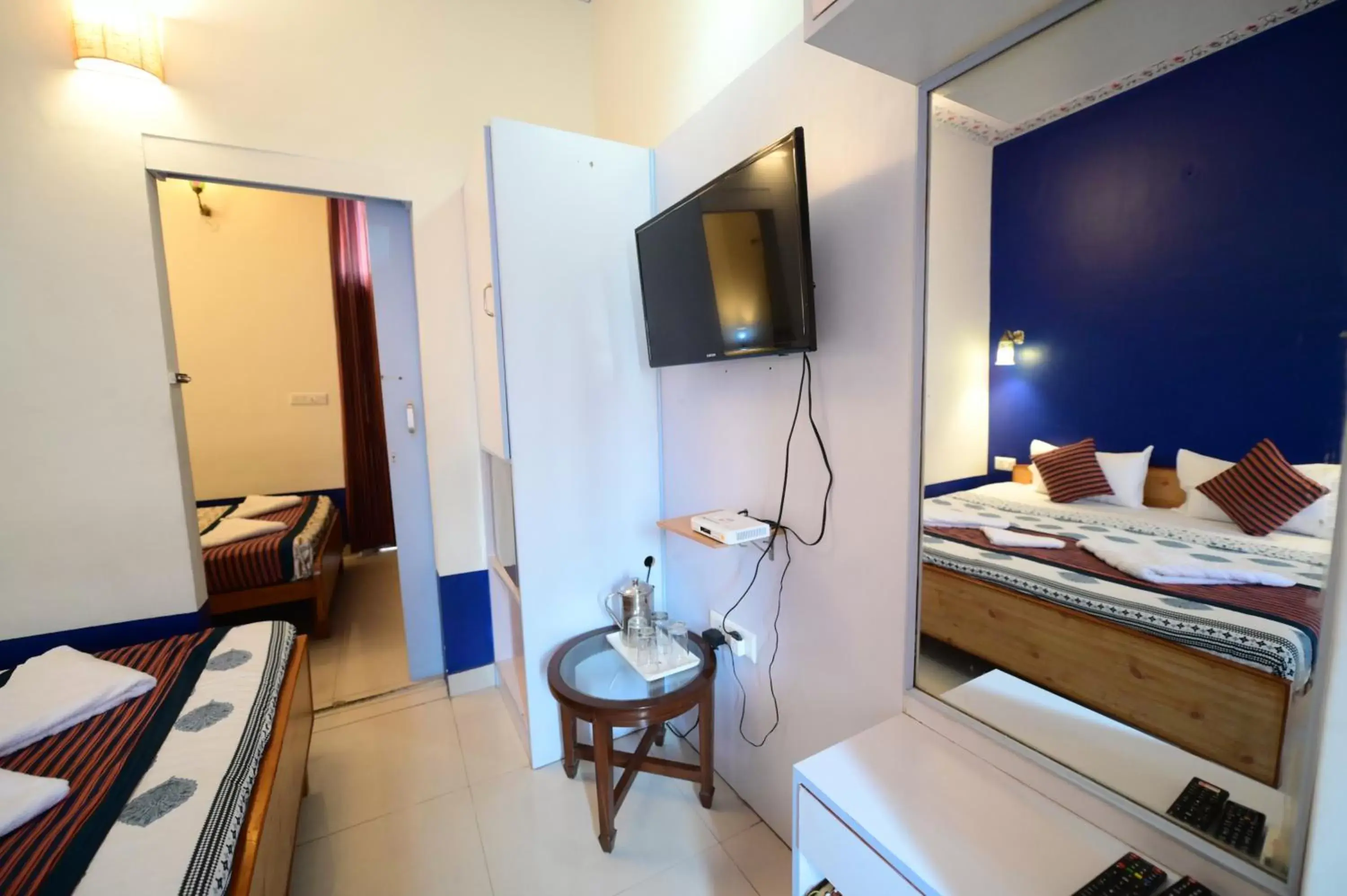 Bed, TV/Entertainment Center in Chitra Katha - A Story Per Stay