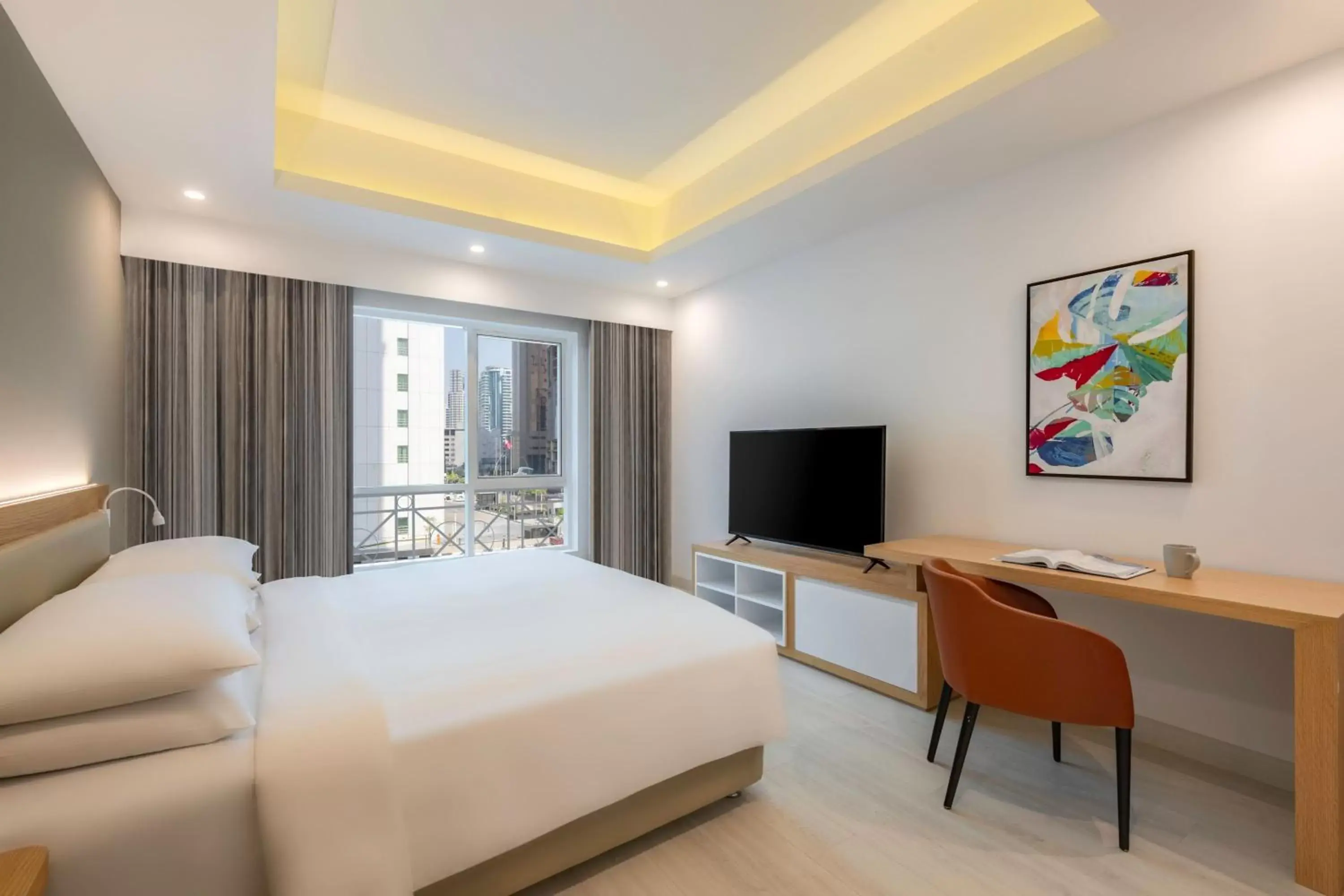 Bedroom, TV/Entertainment Center in Marriott Executive Apartments City Center Doha