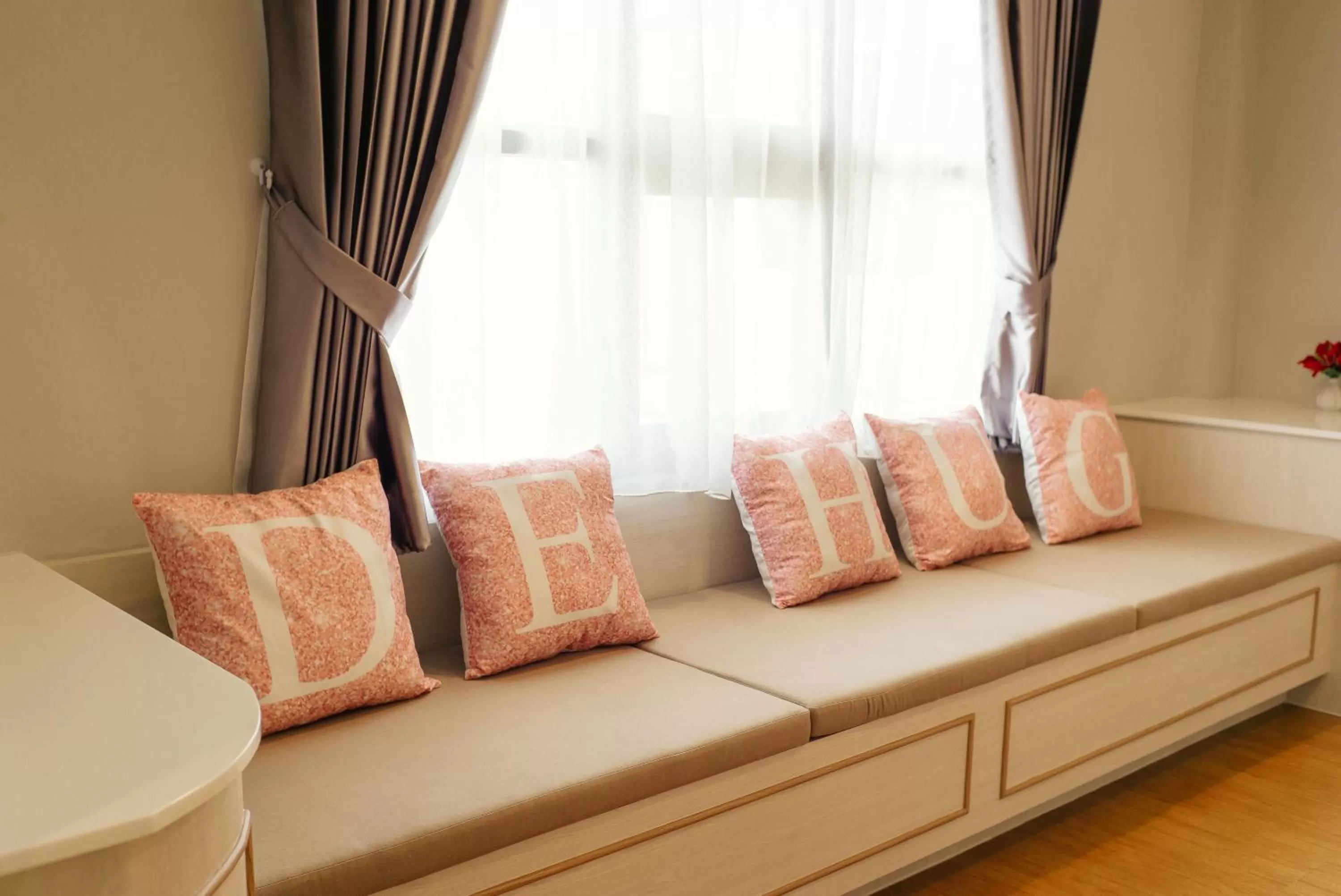 Bed in De Hug Hotel & Residence