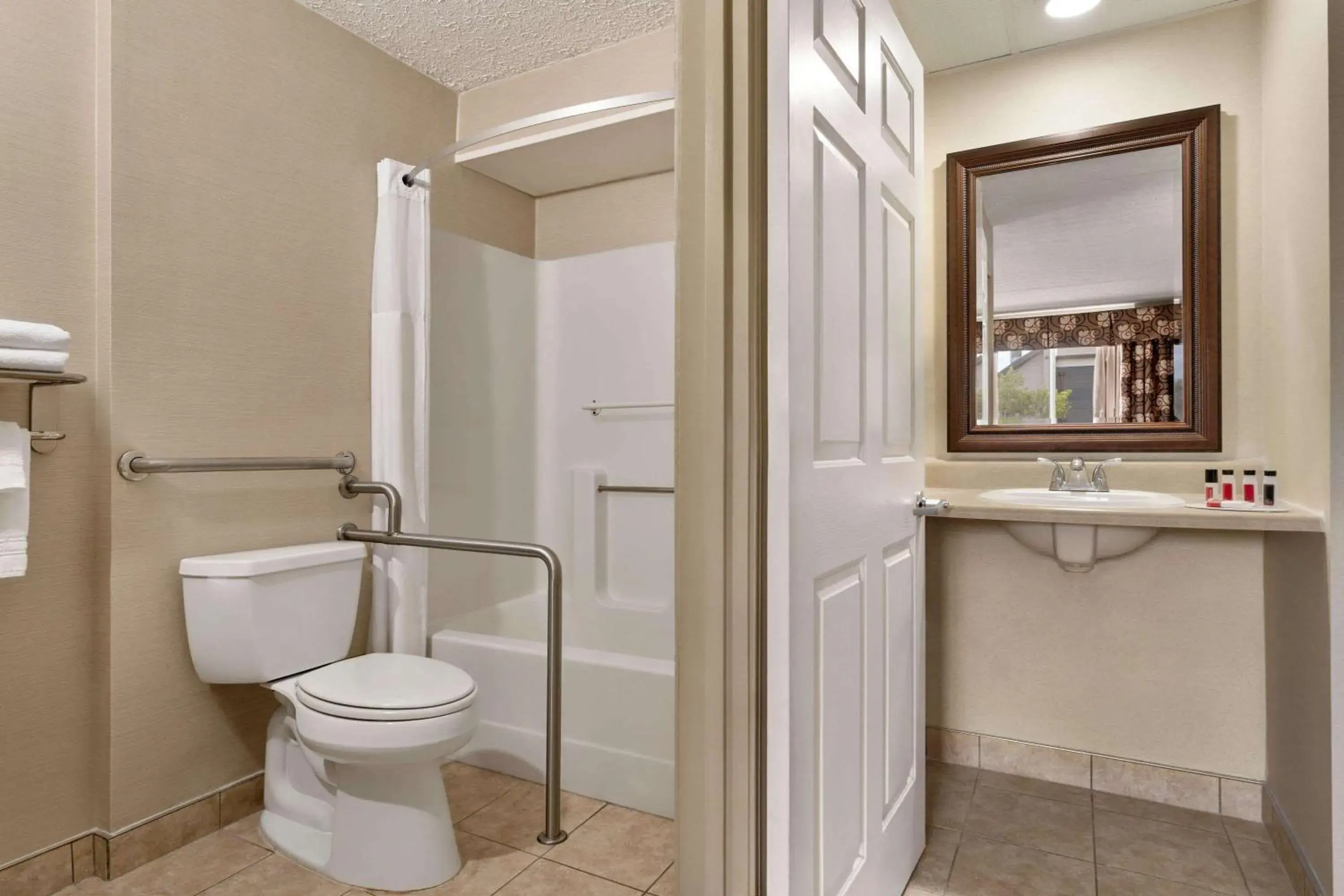 Bathroom in Days Inn by Wyndham Airport/Maine Mall