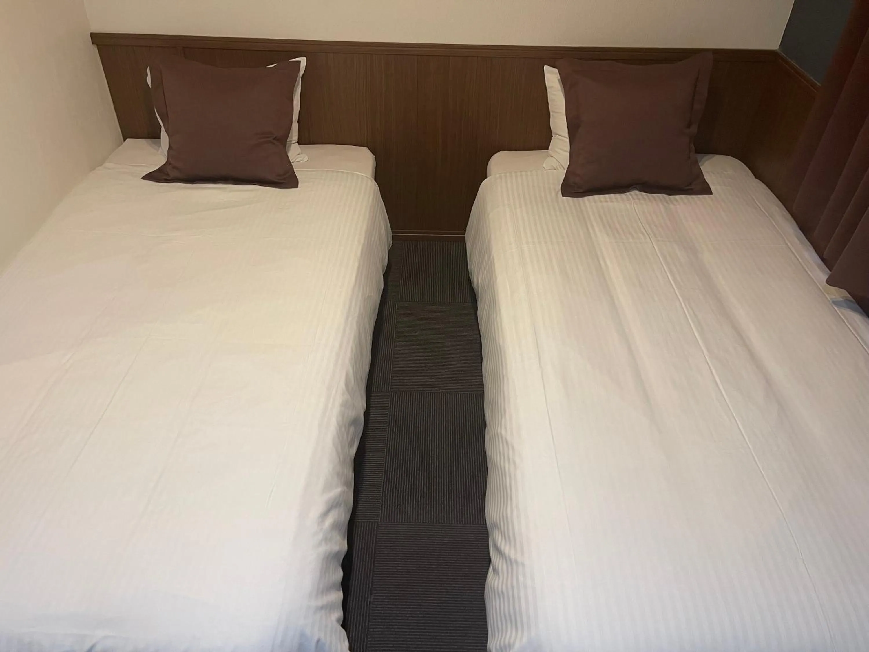 Bed in Kansai Airport Spa Hotel Garden Palace