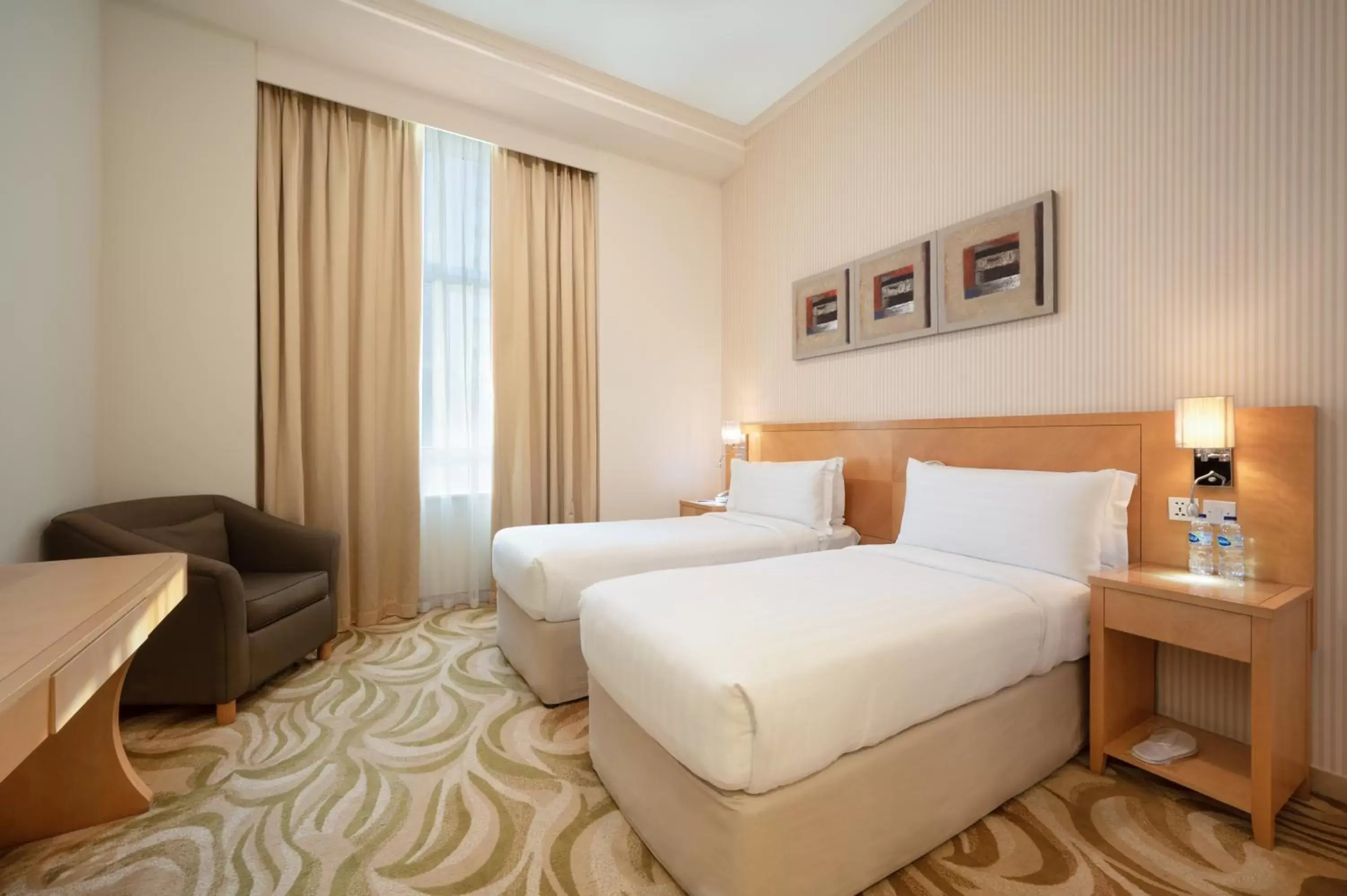Bed in Oaks Liwa Heights Hotel Suites