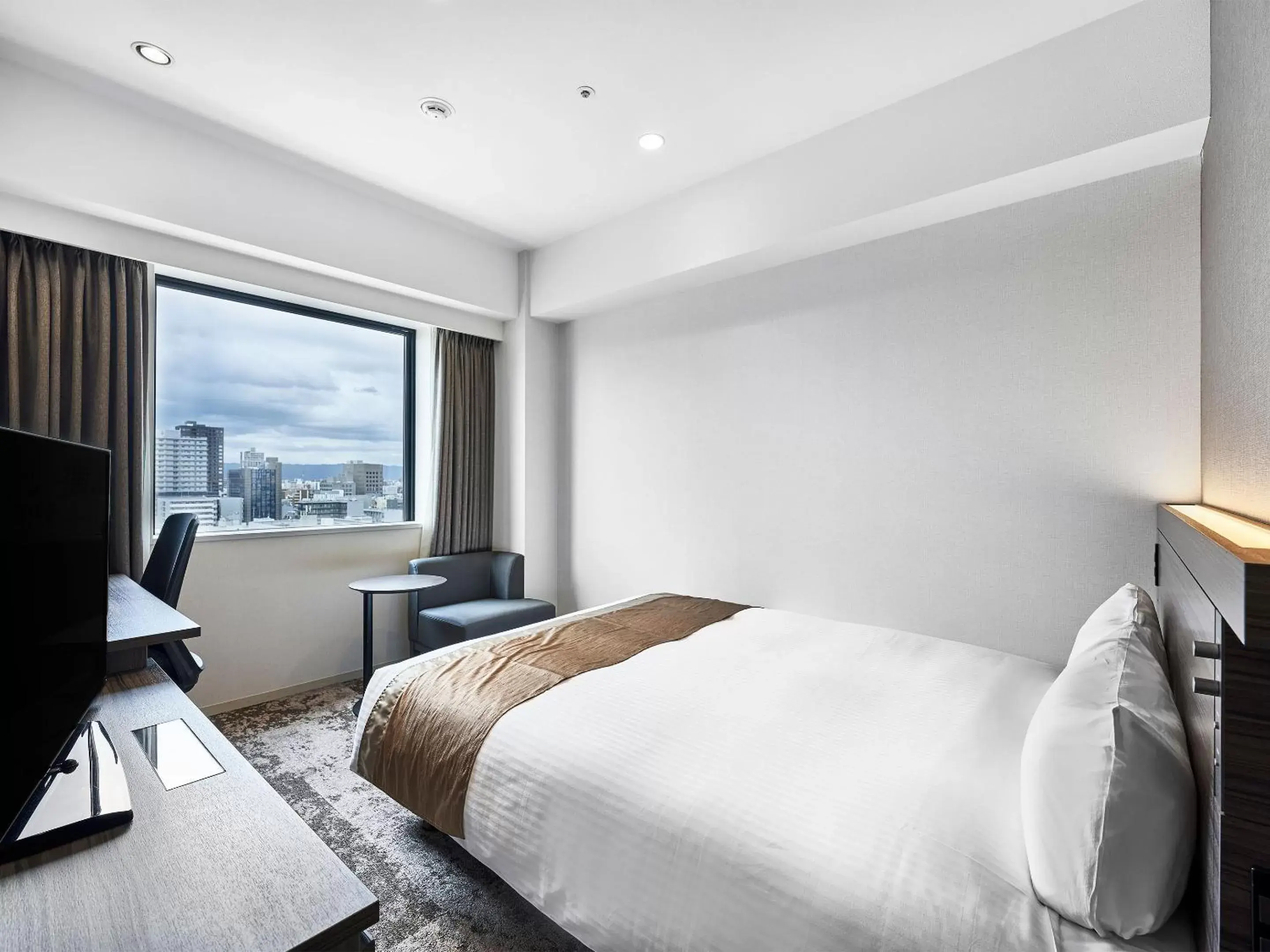 Bed in DEL style Osaka-Shinsaibashi by Daiwa Roynet Hotel